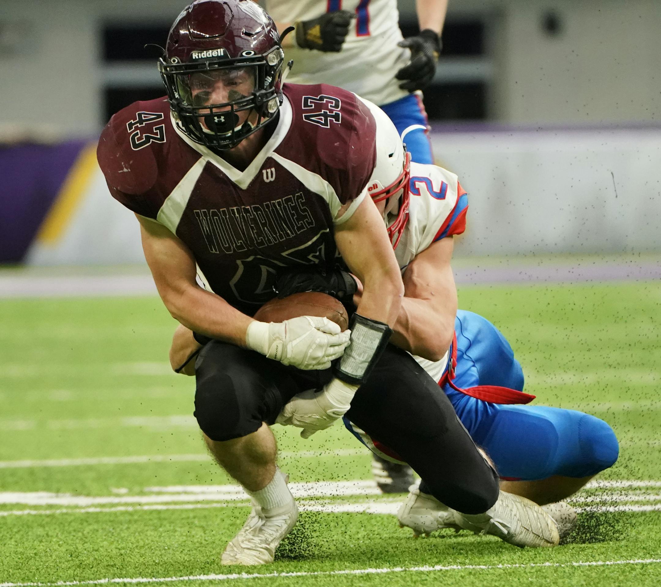 Mountain Lake running back Mace Herrig (43) held onto the ball despite Win-E-Mac's Nathan Fortmann's (2) attempt to strip it from him on this run in the second half. ] Shari L. Gross ¥ shari.gross@startribune.com Mountain Lake defeated Win-E-Mac 45-6 in a 9-man state semifinal game at U.S. Bank Stadium in Minneapolis, Minn. on Friday, Nov. 15, 2019. 11:30 a.m., 2A, Barnesville vs. Caledonia
2 p.m., 5A, Coon Rapids vs. Chaska