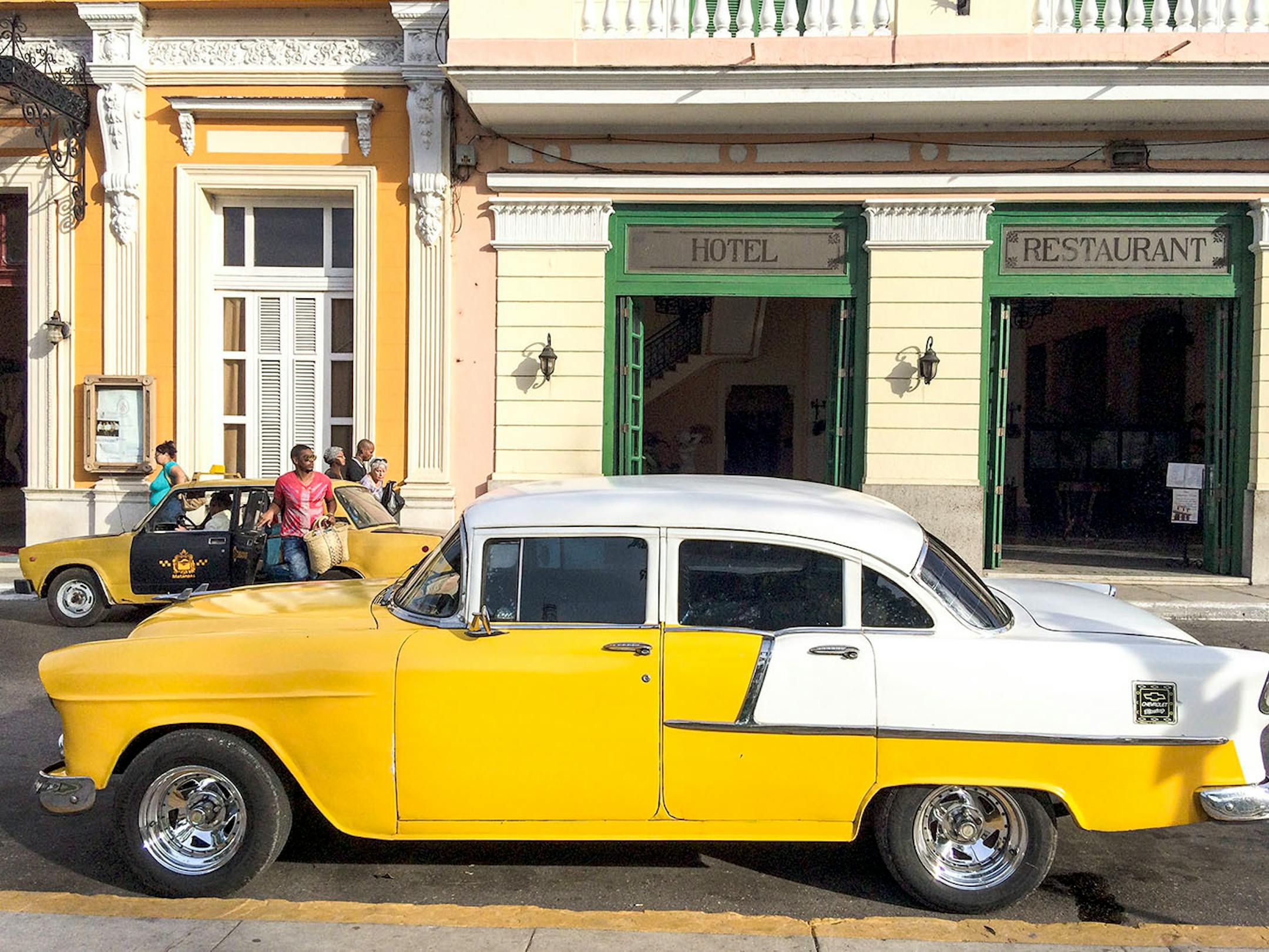 Cars pull up in front of the main hotel on Matanzas' center square. [ Photos by Amelia RaynoThe Minneapolis Star Tribune