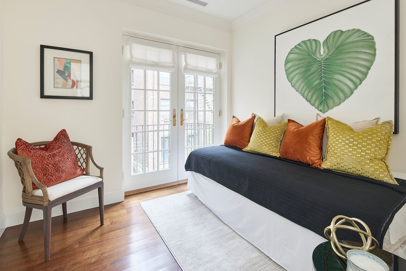 Warm fall colors adds coziness and warmth to a guest bedroom.