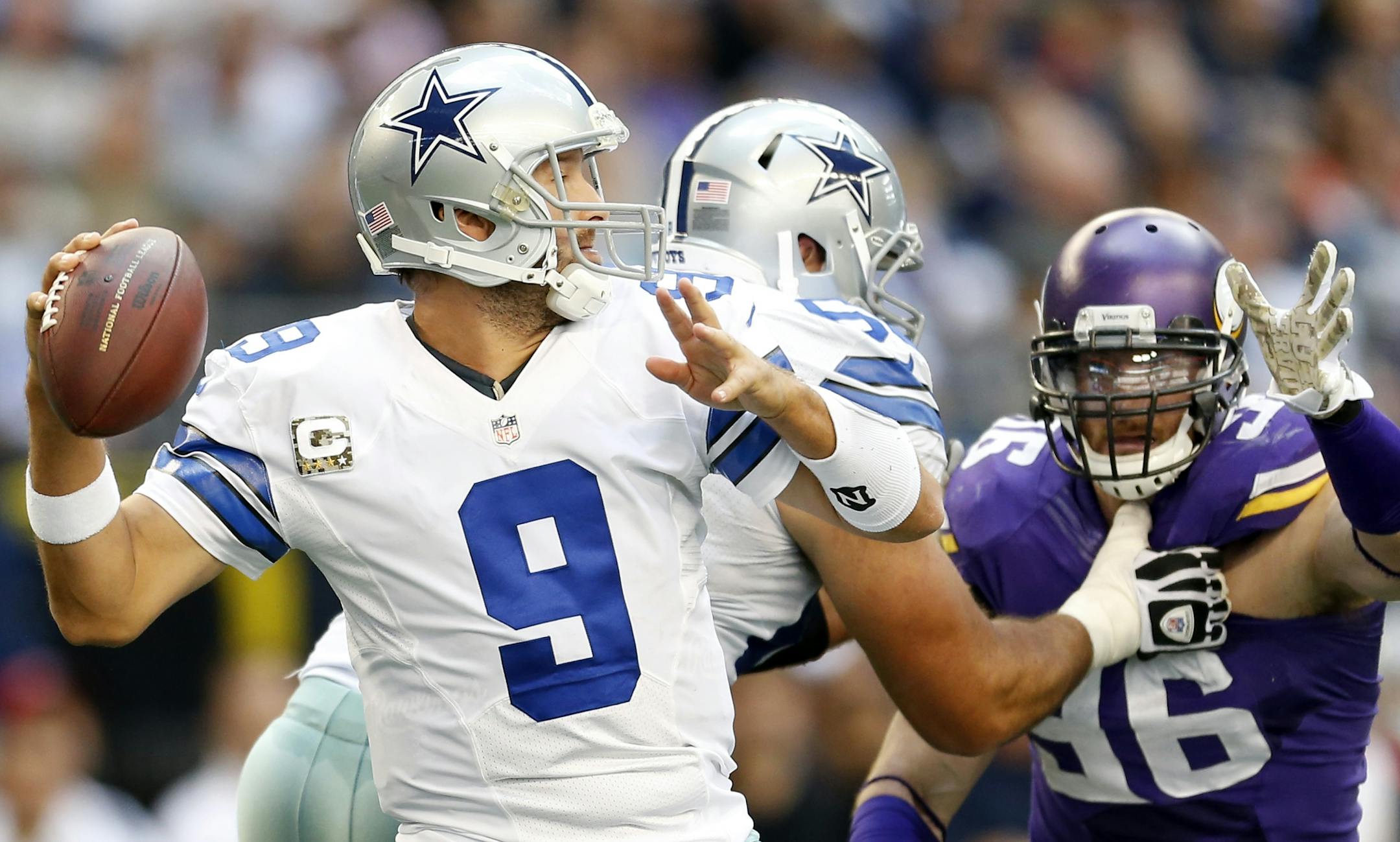 Cowboys quarterback Tony Romo (9) attempted a pass in the second quarter. Dallas beat Minnesota by a final score of 27-23.