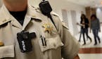 Shelby County Sheriff's Department SRO Joseph Fox wears a personal body camera while on duty on Oct. 15, 2014, at Southwind High School in Memphis, Te