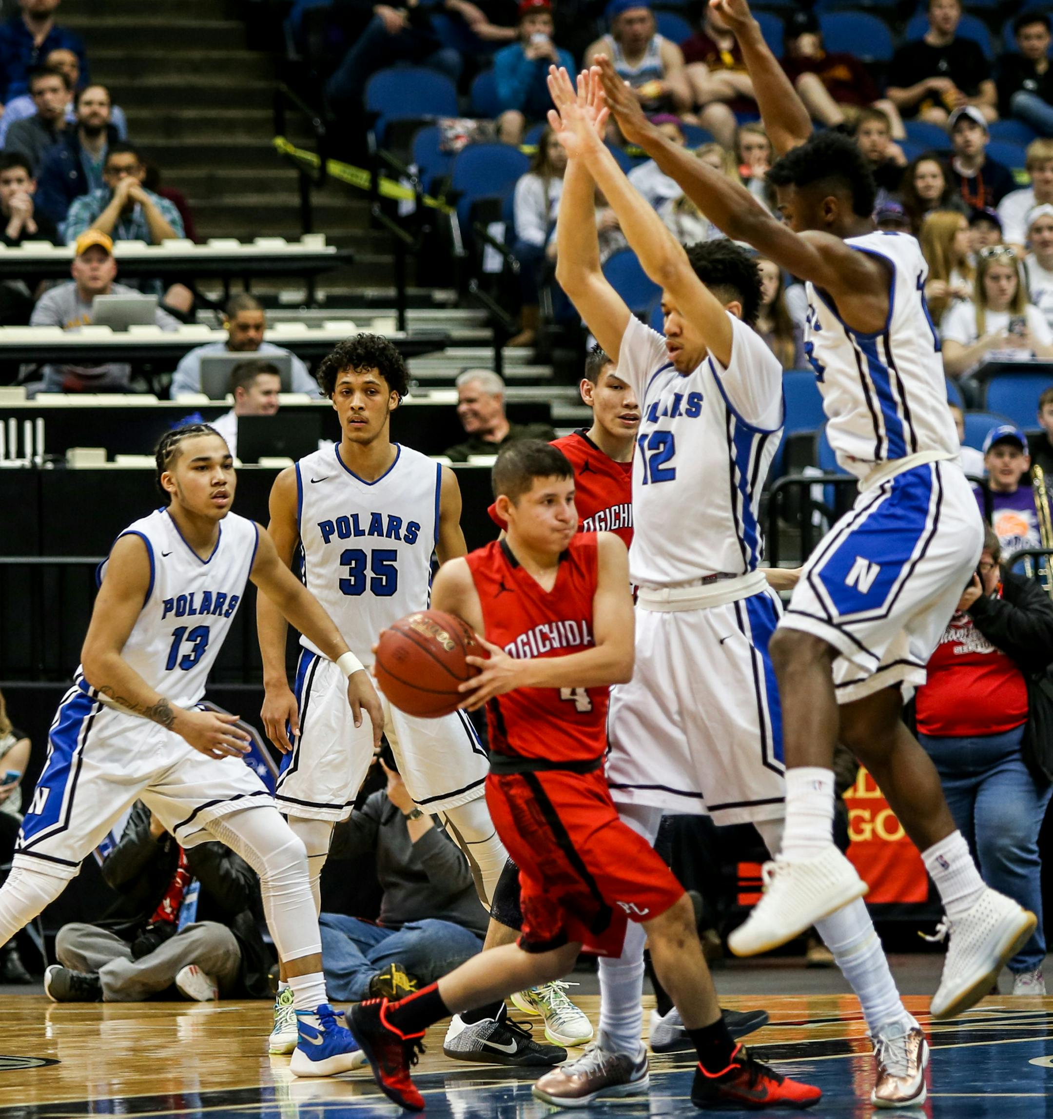 Red Lake Highschool, Jamie Cook, runs with the ball the second half of the game against Minneapolis North.] ELIZABETH BRUMLEY brumley.elizabeth@gmail.com 2016 boys basketball state tournament * Minneapolis North vs. Red Lake, class 1A semi finals.