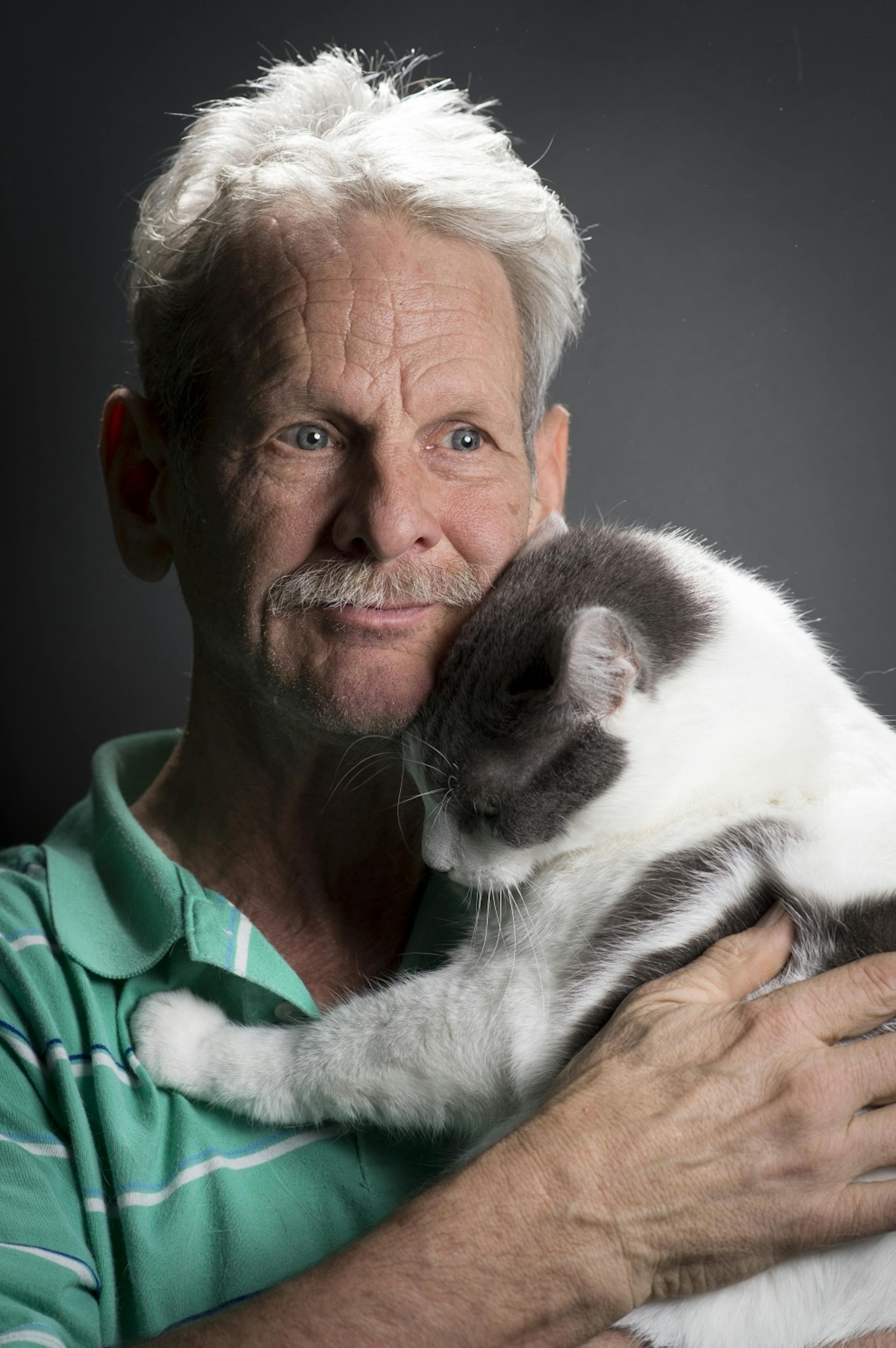Dave Long is pictured with Romeo, a 3-year-old short-haired cat that he and his wife Gayle enter into cat shows.