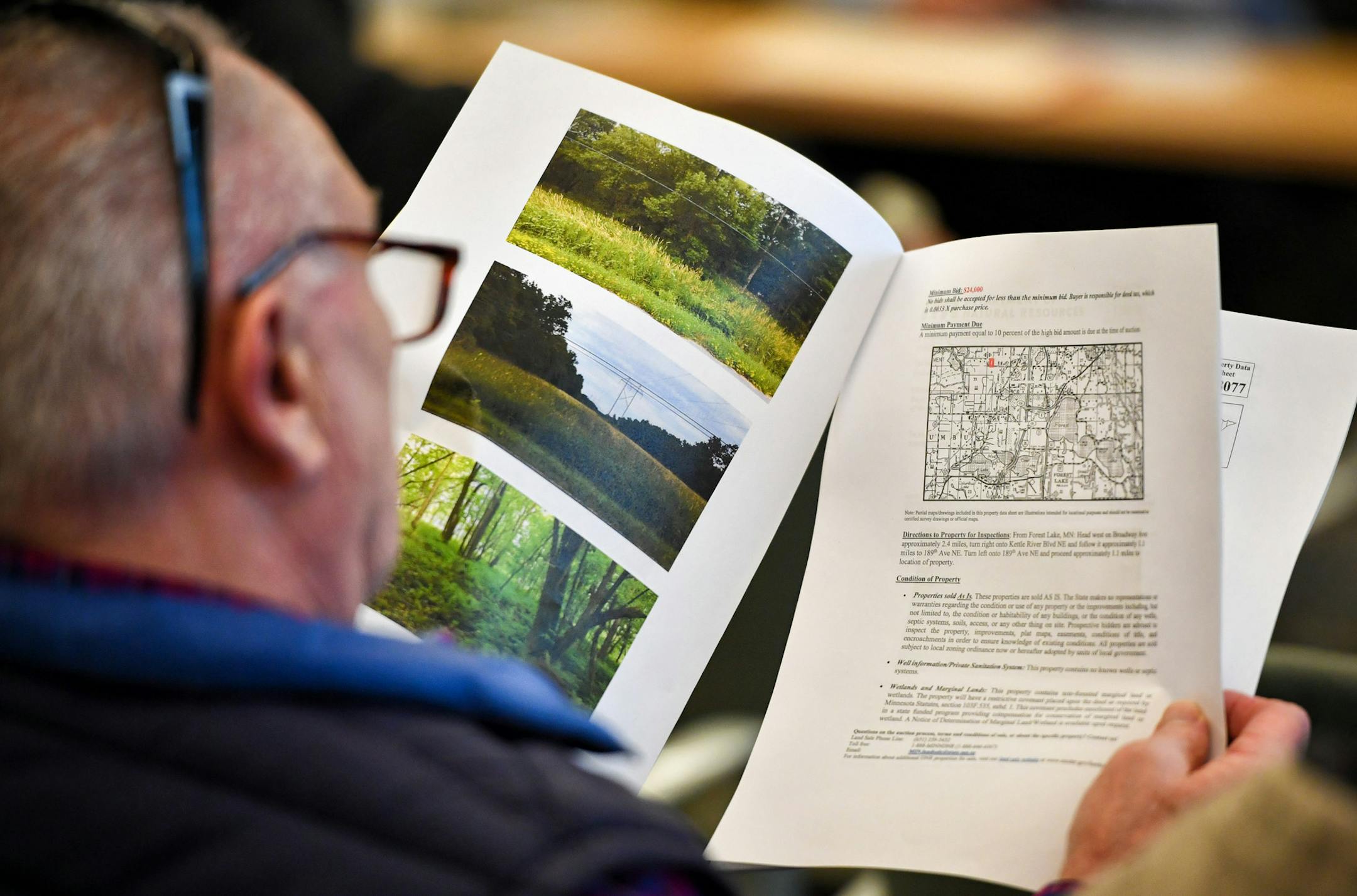 Gary Swenson looked over land up for auction at the DNR headquarters. ] GLEN STUBBE &#x2022; glen.stubbe@startribune.com Monday, December 18, 2017 The DNR this month is auctioning off the first public lands under a new program to carve off scattered surplus parcels and invest the proceeds in something with greater value. We look at land nearby that they are auctioning off in St. Paul.