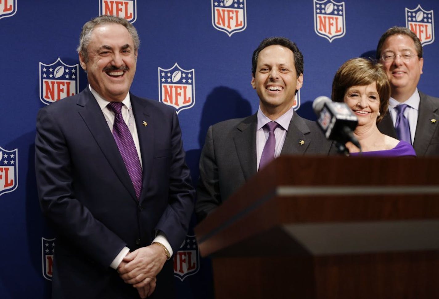 Minnesota Vikings owners Zygi Wilf, left, and Mark Wilf, right, speak at a news conference after Minneapolis was selected as the host for 2018 Super Bowl at the NFL's spring meeting, Tuesday, May 20, 2014, in Atlanta. Minneapolis will host the 2018 Super Bowl after a vote by owners on Tuesday rewarded the city for getting a new stadium deal. The owners chose Minneapolis and the new $1 billion stadium planned for the site of the old Metrodome to host the championship over New Orleans and Indianap