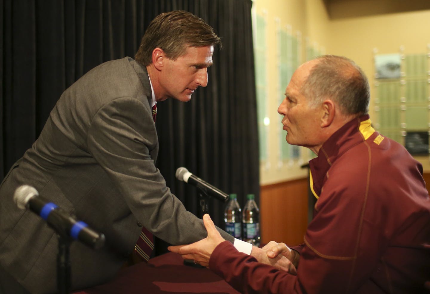 Mark Coyle, left, was congratulated by former University of Minnesota Athletic Director Joel Maturi after Coyle finished his inaugural news conference as the new AD of the U of M Wednesday afternoon at TCF Bank Stadium. ] JEFF WHEELER &#xef; jeff.wheeler@startribune.com Former Syracuse Athletic Director Mark Coyle was introduced as the new AD at the University of Minnesota at a news conference Wednesday afternoon, May 11, 2016 at the M Club room at TCF Bank Stadium