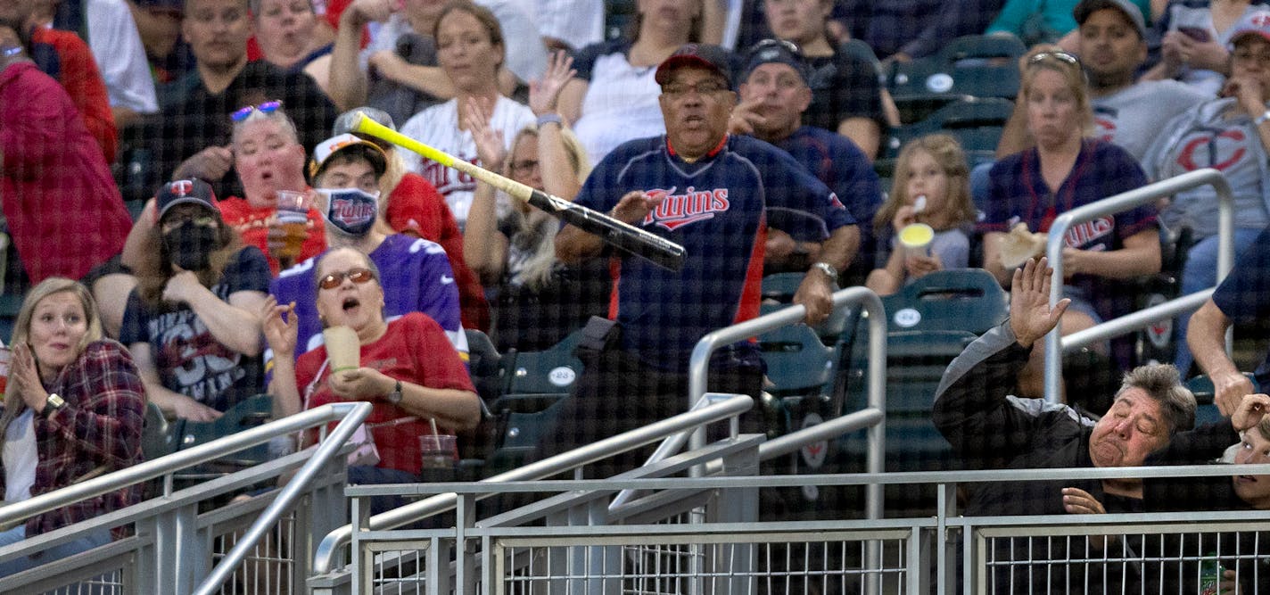 Fans try to avoid a bat that slipped out of the hands of Drew Waters (6) of the Kansas City Royals in the third inning Wednesday, September 14, 2022, at Target Field in Minneapolis, Minn. ] CARLOS GONZALEZ • carlos.gonzalez@startribune.com