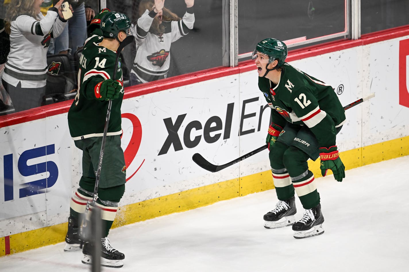 Minnesota Wild center Joel Eriksson Ek (14) and left wing Matt Boldy (12) celebrate a goal by Boldy against the Vegas Golden Knights during the second period Monday, April 3, 2023 at the Xcel Energy Center in St. Paul, Minn.. ] AARON LAVINSKY • aaron.lavinsky@startribune.com