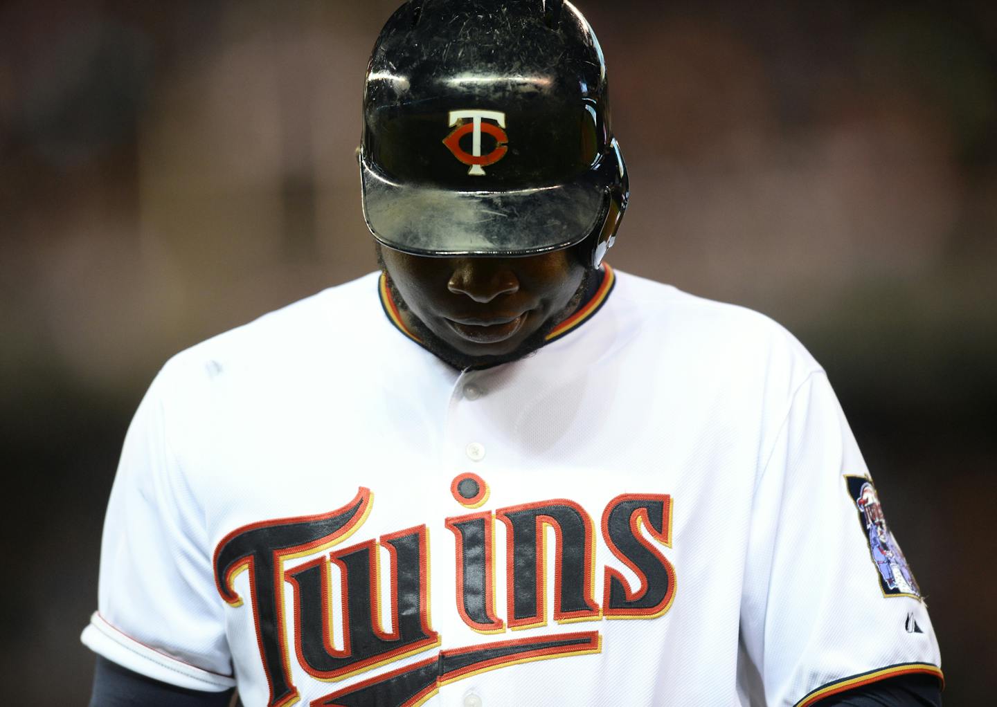 Minnesota Twins designated hitter Miguel Sano (22) looked down to the ground after flying out to left field in the bottom of the third inning.