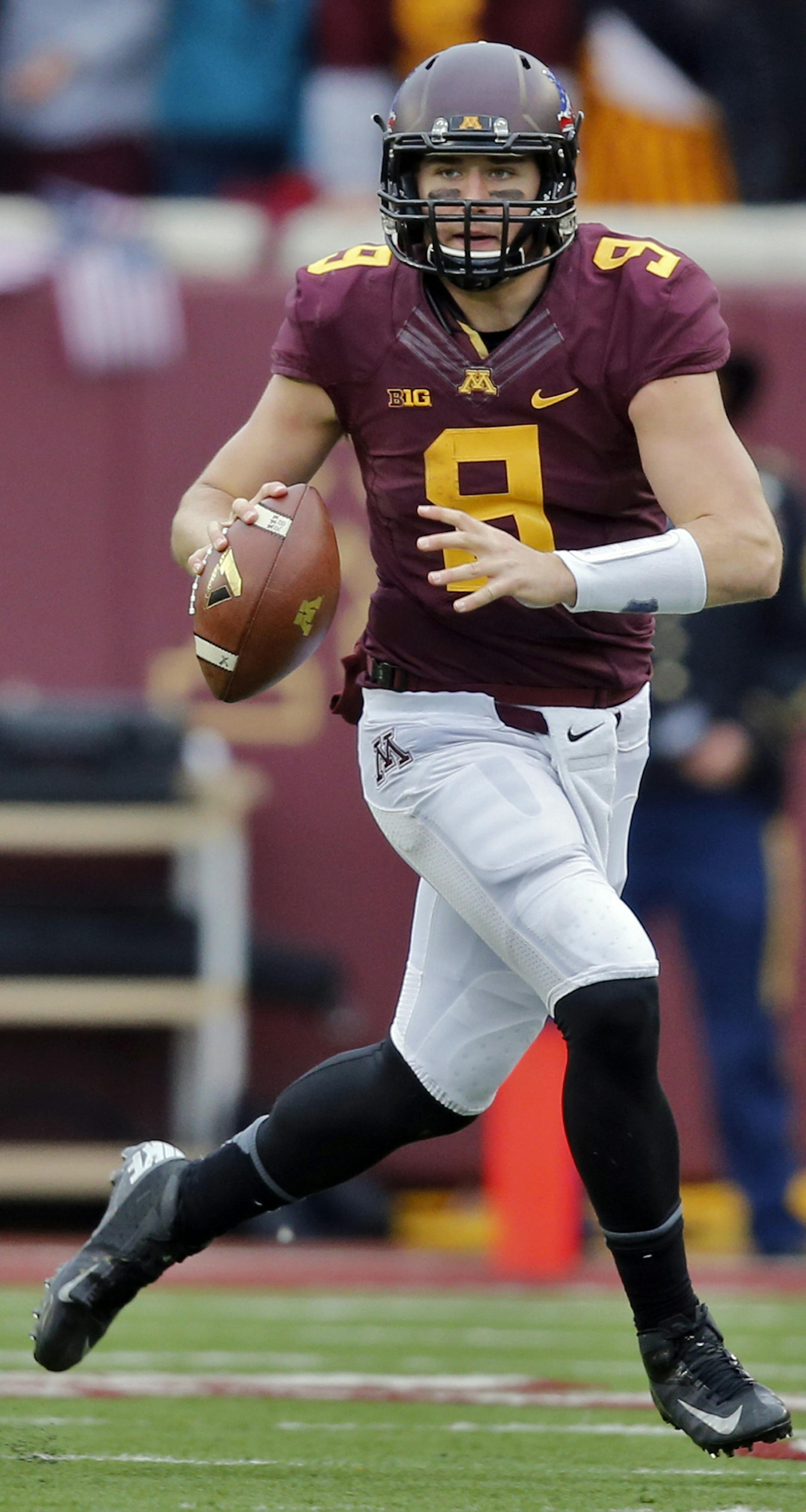 Minnesota Gophers vs. Penn State. Minnesota won 24-10. Minnesota quarterback Philip Nelson looked for a receiver downfield as he rolled out of the pocket. (MARLIN LEVISON/STARTRIBUNE(mlevison@startribune.com) ORG XMIT: MIN1311091644269900