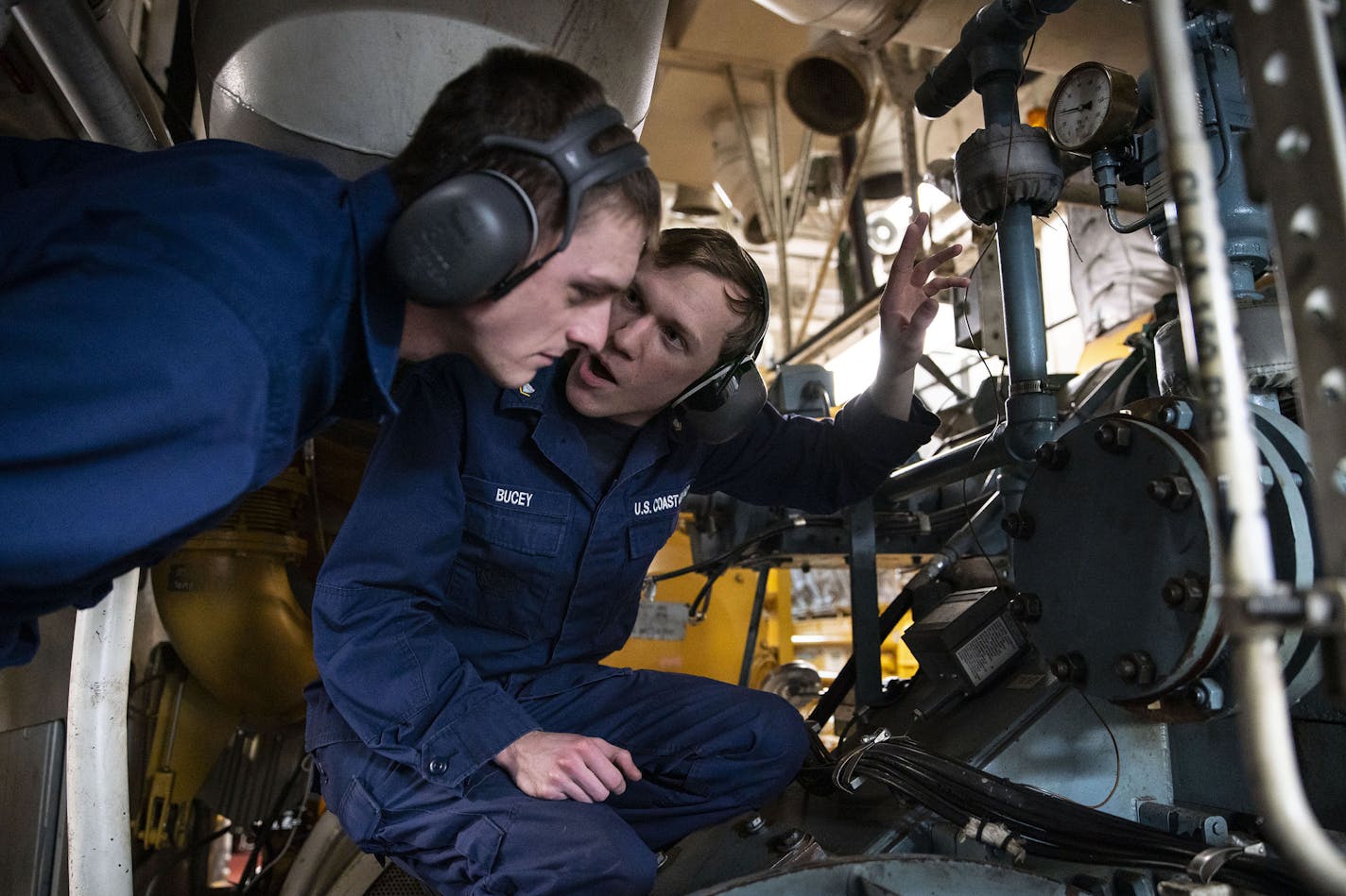 (Left) Machine technician third class Andrew Tuggle listened to machine technician third class Brendan Bucey as he explained how different machines worked in the engine room of the USCGC Alder on Tuesday. ]
ALEX KORMANN &#x2022; alex.kormann@startribune.com The Duluth Port and many other Great Lakes shippers are pushing the Coast Guard to buy new, stronger icebreakers, saying the lack of capability is denting the shipping season. The USCGC Alder went out around the Duluth Harbor and nearby chann