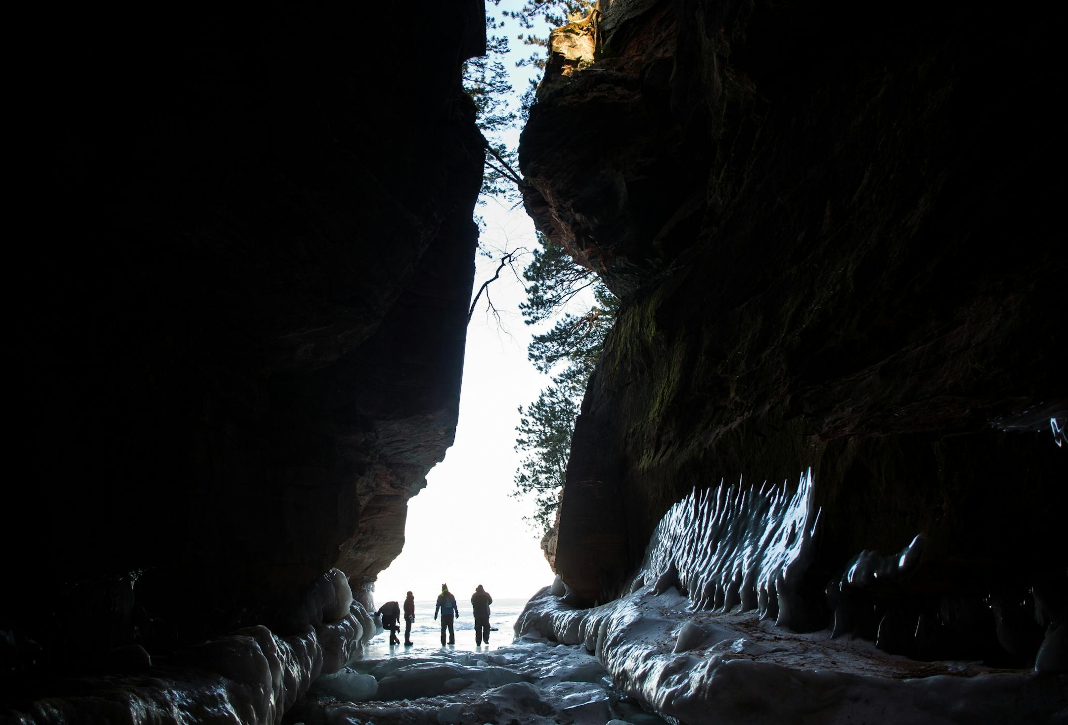 People explore an ice cave at the Apostle Islands National Lakeshore on Lake Superior, Friday, Feb. 27, 2015, near Bayfield, Wis.
