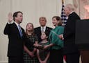 Retired Justice Anthony Kennedy, right, ceremonially swears-in Supreme Court Justice Brett Kavanaugh, as President Donald Trump looks on, in the East 