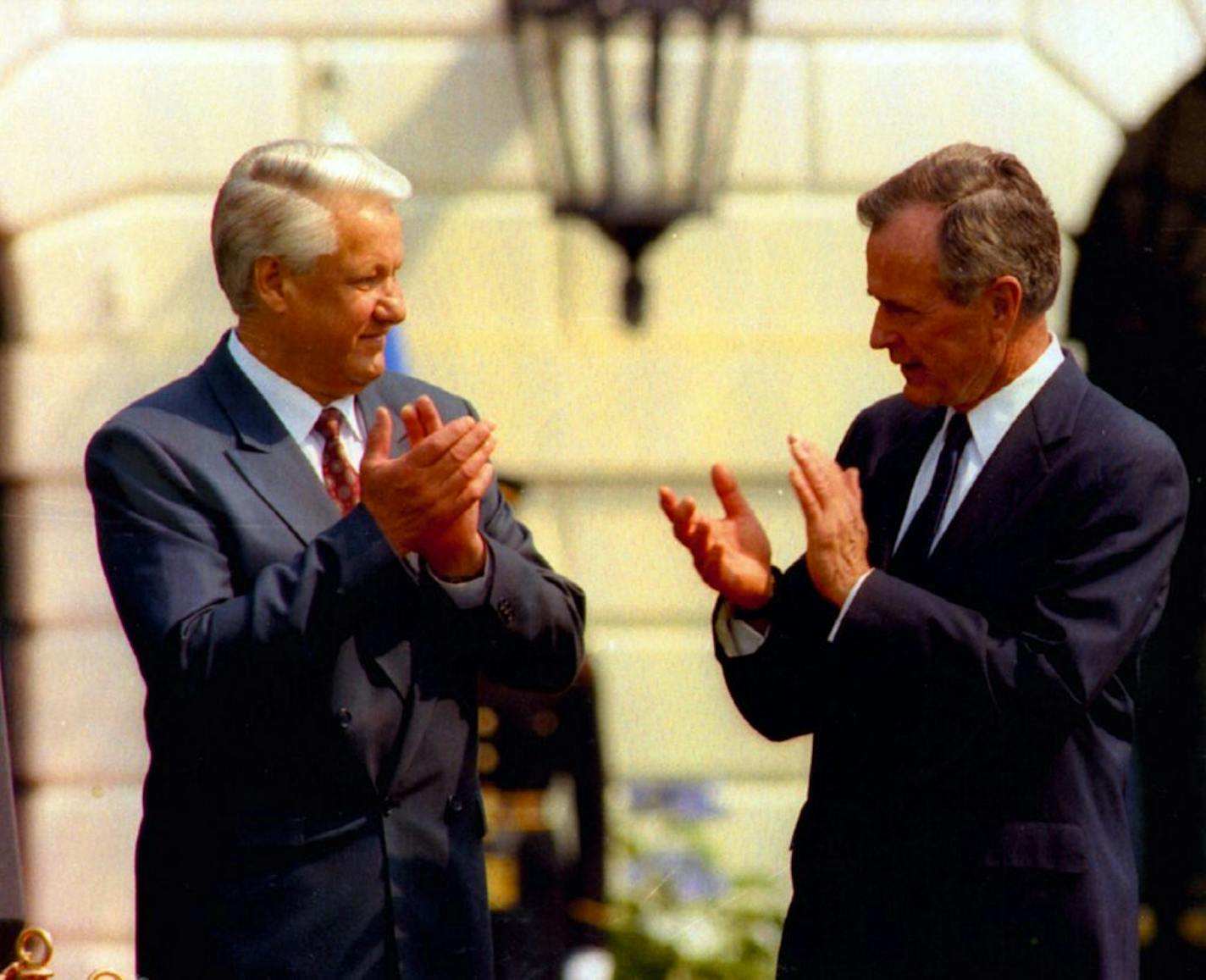 1992 file photo of Boris Yeltsin and President George Bush applauding each other after announcing terms of sweeping nuclear arms treaty.