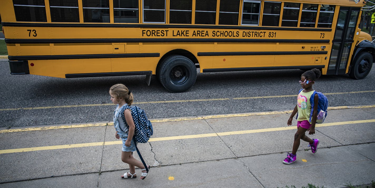 Children arrive for classes at Forest View Elementary, where social distancing is enforced. Kids are back to school. Sort of. In what could be a preview of things to come this fall, a small number of Minnesota school districts and charter schools are using a "hybrid" instruction model.