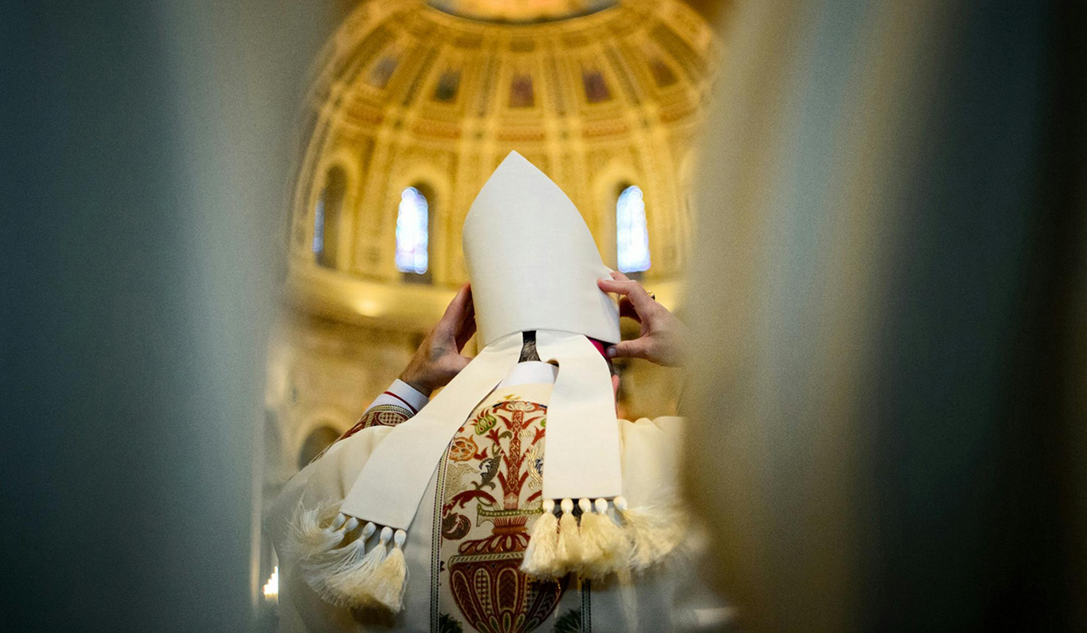 Archbishop Bernard Hebda adjusted his bishops hat, called a miter, as he entered the St. Paul Cathedral