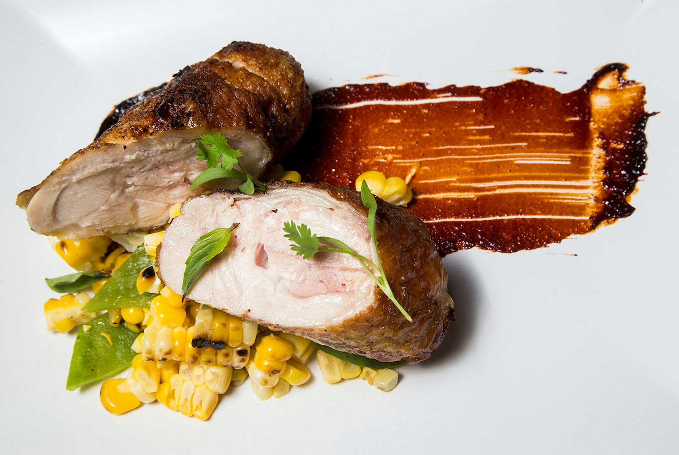 Crispy chicken with grilled corn, roasted Anaheim peppers, basil, lime and toasted chili glaze.