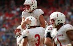 St. John's defensive back Sam Westby (13) was congratulated by Dusty Krueger (3) during a game in 2017