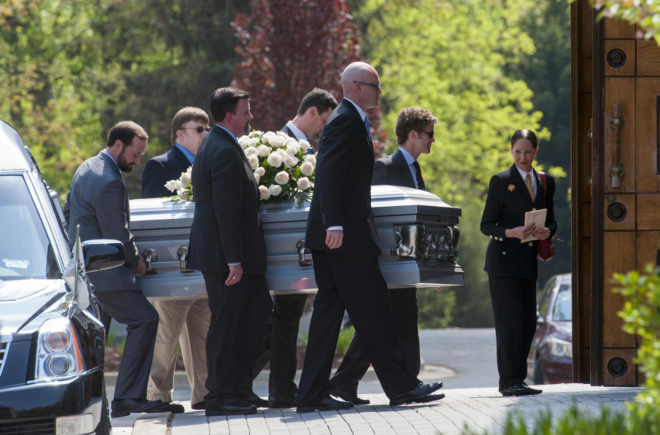 The casket containing the remains of former Rep. Jim Oberstar, D-Minn., is carried into Our Lady of Mercy Catholic Church for a Mass of Christian Burial, in Potomac, Md., Thursday, May 8, 2014. Oberstar served in the United States House of Representatives from 1975 to 2011 and died in his sleep at home in Potomac, Md., on May, 3, 2014. He was 79-years old. (AP Photo/Cliff Owen)