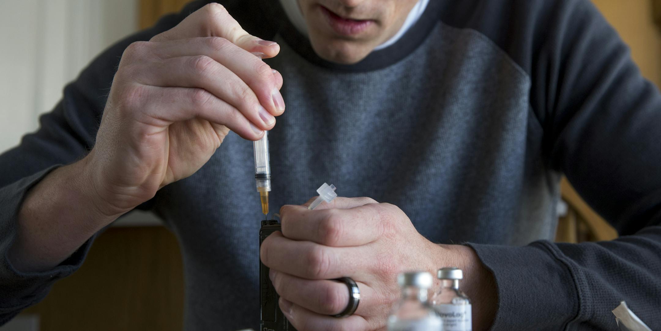 A Type 1 diabetes patient filling his insulin pump at home, in American Fork, Utah, Feb. 26, 2017. Consumers whose drug benefits are managed by Express Scripts could see their out-of-pocket costs for insulin limited to $25 a month under a plan announced on April 3, 2019. The move is aimed at addressing rising anger over the cost of the lifesaving product, whose list price has skyrocketed in recent years. (Kim Raff/The New York Times)