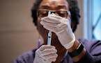 Registered nurse Donna Feaster administered a flu shot in Chicago, Oct. 3, 2018.
