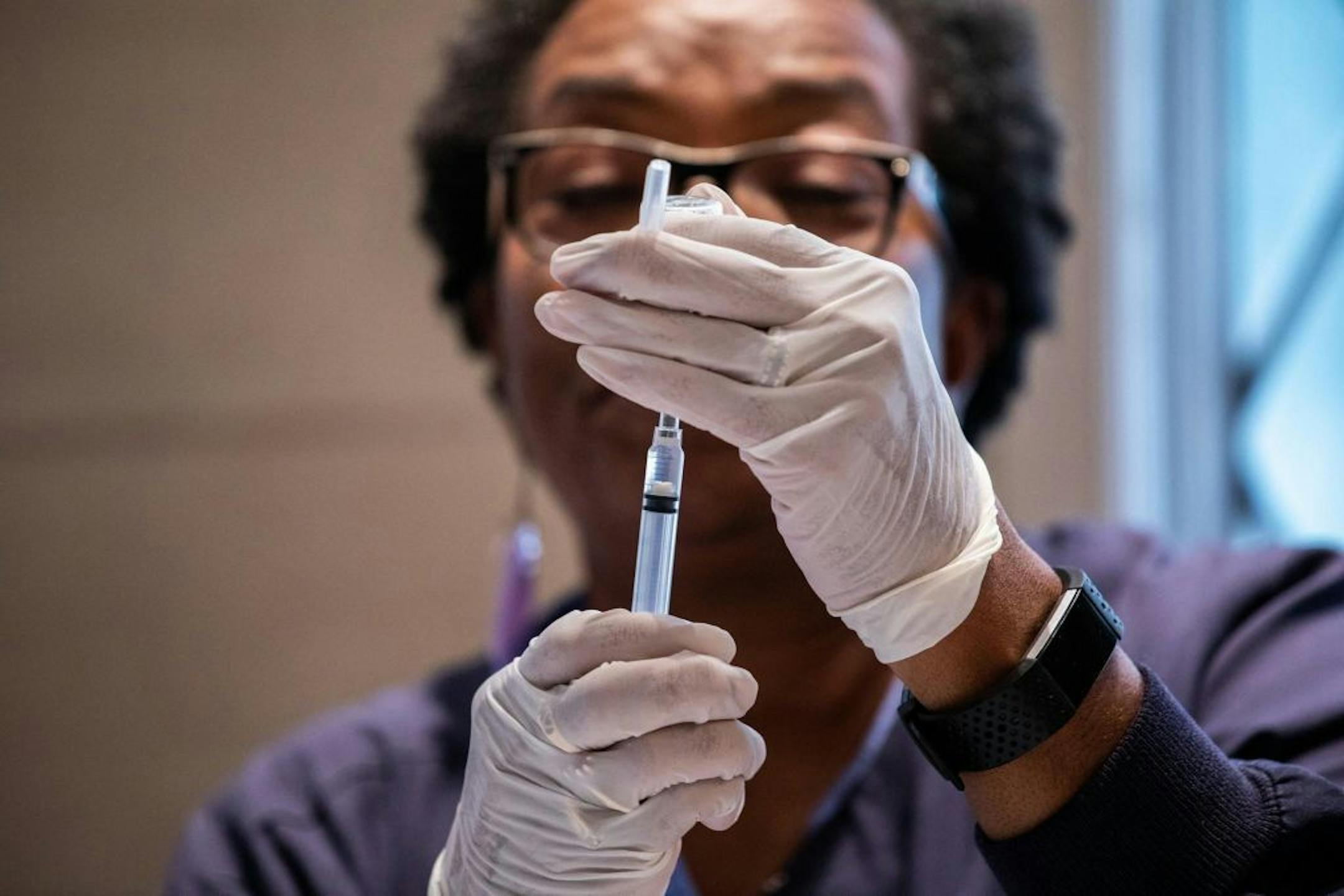 Registered nurse Donna Feaster administered a flu shot in Chicago, Oct. 3, 2018.