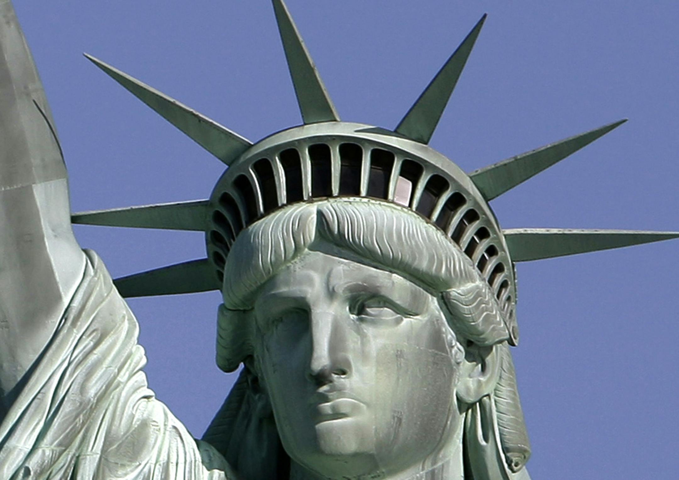 FILE- This May 20, 2009 file photo shows the Statue of Liberty against the deep blue sky in New York Harbor. On Friday, Oct. 28, 2011 the statue will host the 125th anniversary of its dedication with a Naturalization Ceremony, the presentation of a gift to continue its preservation and an evening fireworks display.