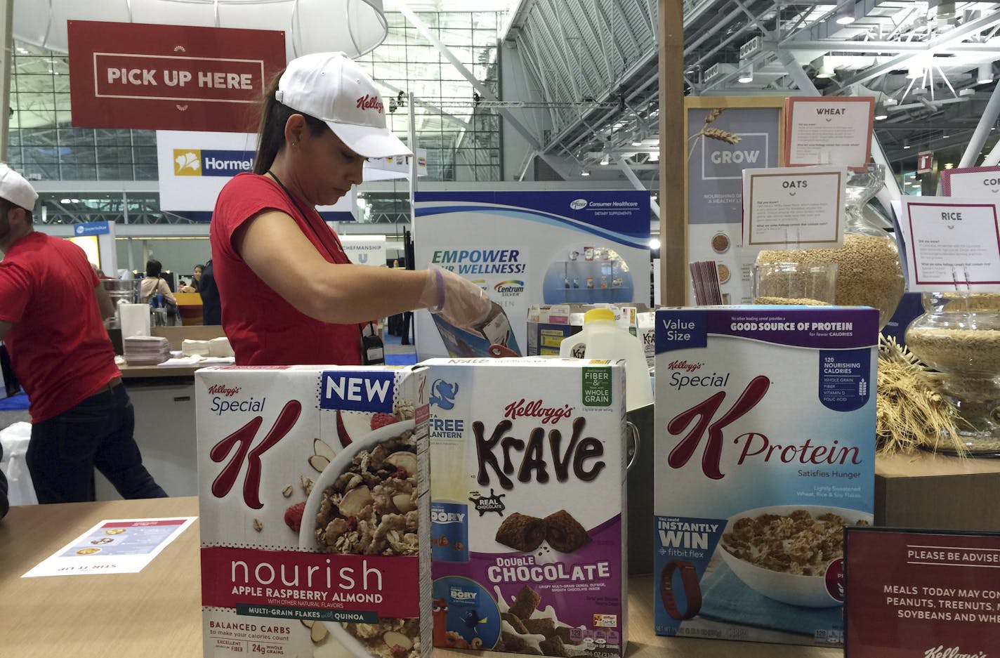 FILE - This Oct. 16, 2016, file photo shows the Kellogg booth at an annual dietitians' conference, where company representatives explained the health benefits of their products, in Boston. On its website, amid news of Pop-Tarts and Frosted Flakes, Kellogg touted a distinguished-sounding &#xec;breakfast council&#xee; of &#xec;independent experts&#xee; dedicated to guiding its nutritional efforts. Nowhere did it say that Kellogg paid the council members and spoon-fed them talking points about the