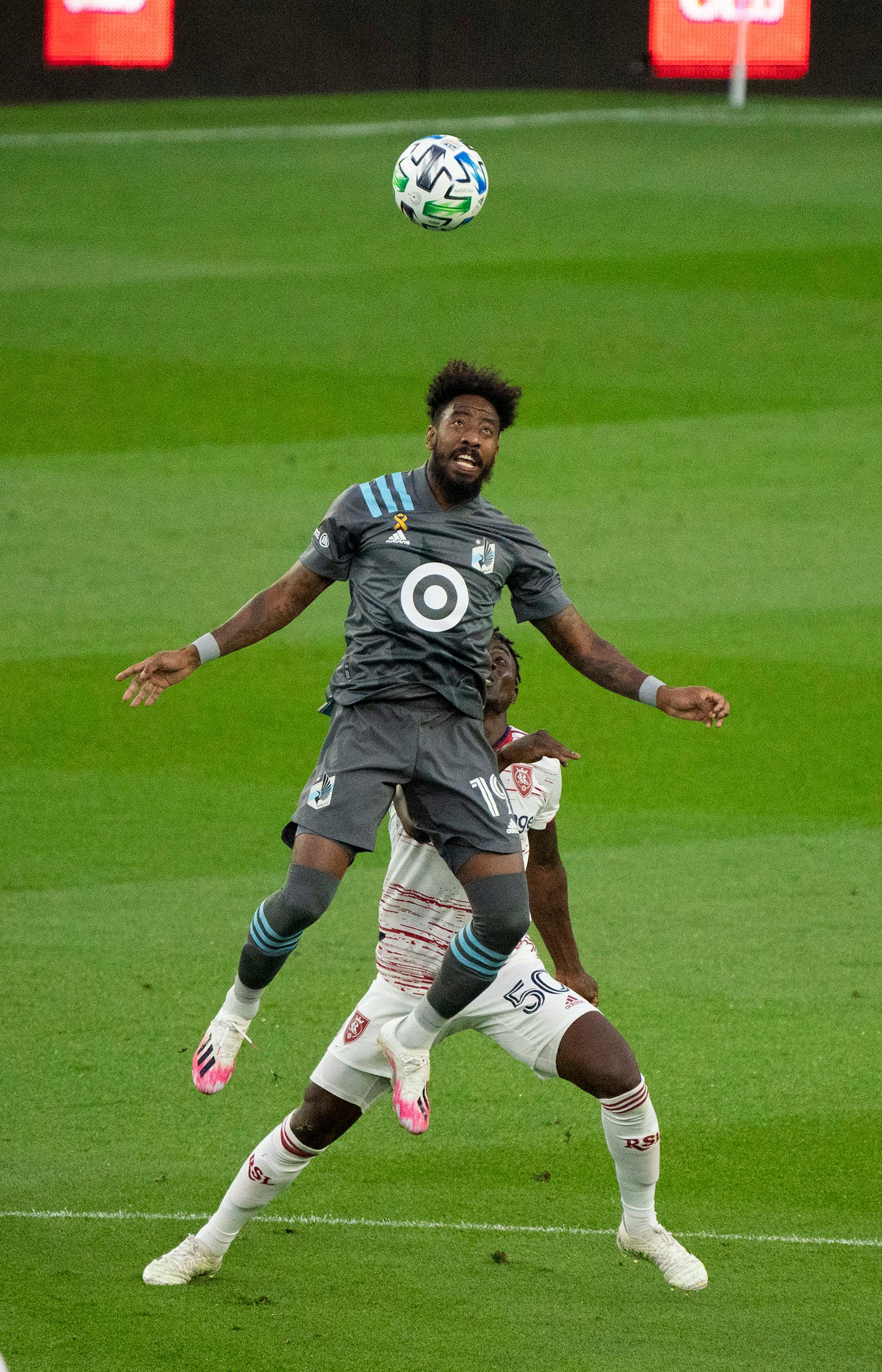 Minnesota United defender Romain Metanire (19) headed the ball ahead of Real Salt Lake forward Sam Johnson (50) in the first half.