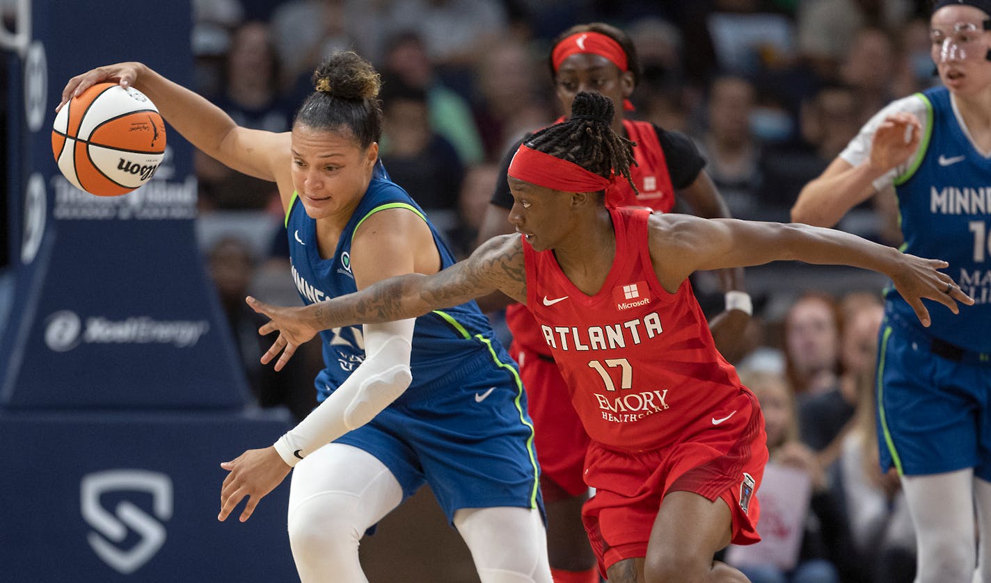 Minnesota Lynx guard Kayla McBride (21), left, and Atlanta Dream guard Erica Wheeler (17) battle for the ball during the second quarter at the Target Center, in Minneapolis, Minn., on Sunday, August 7, 2022. ] Elizabeth Flores • liz.flores@startribune.com