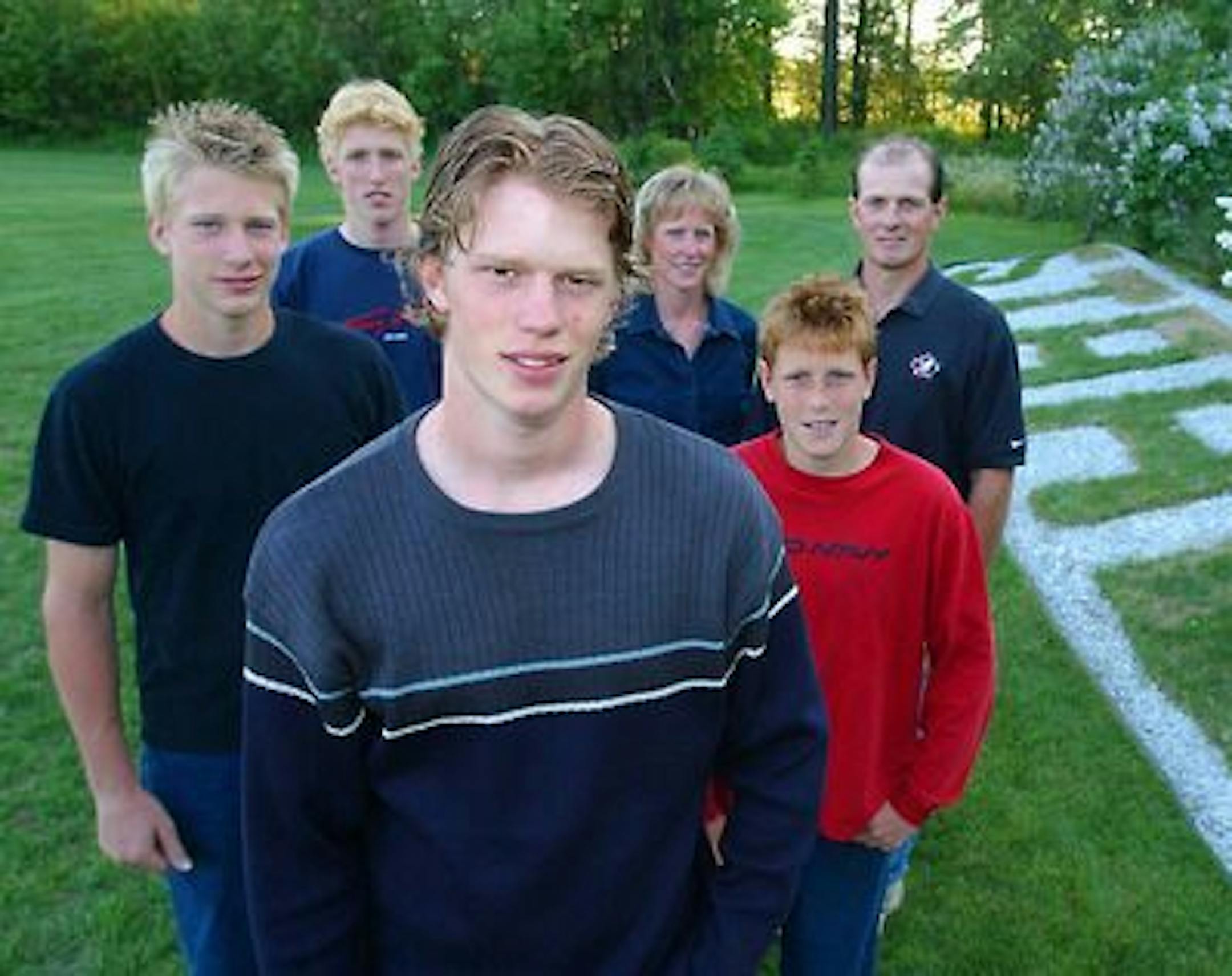 Eric Staal, foreground, as a teenager, posed with his hockey-playing family. From left, brothers Jordan and Marc, mom Linda, brother Jared, dad Henry. All four Staal brothers have played in the NHL. (photo courtesy Carolina Hurricanes)
