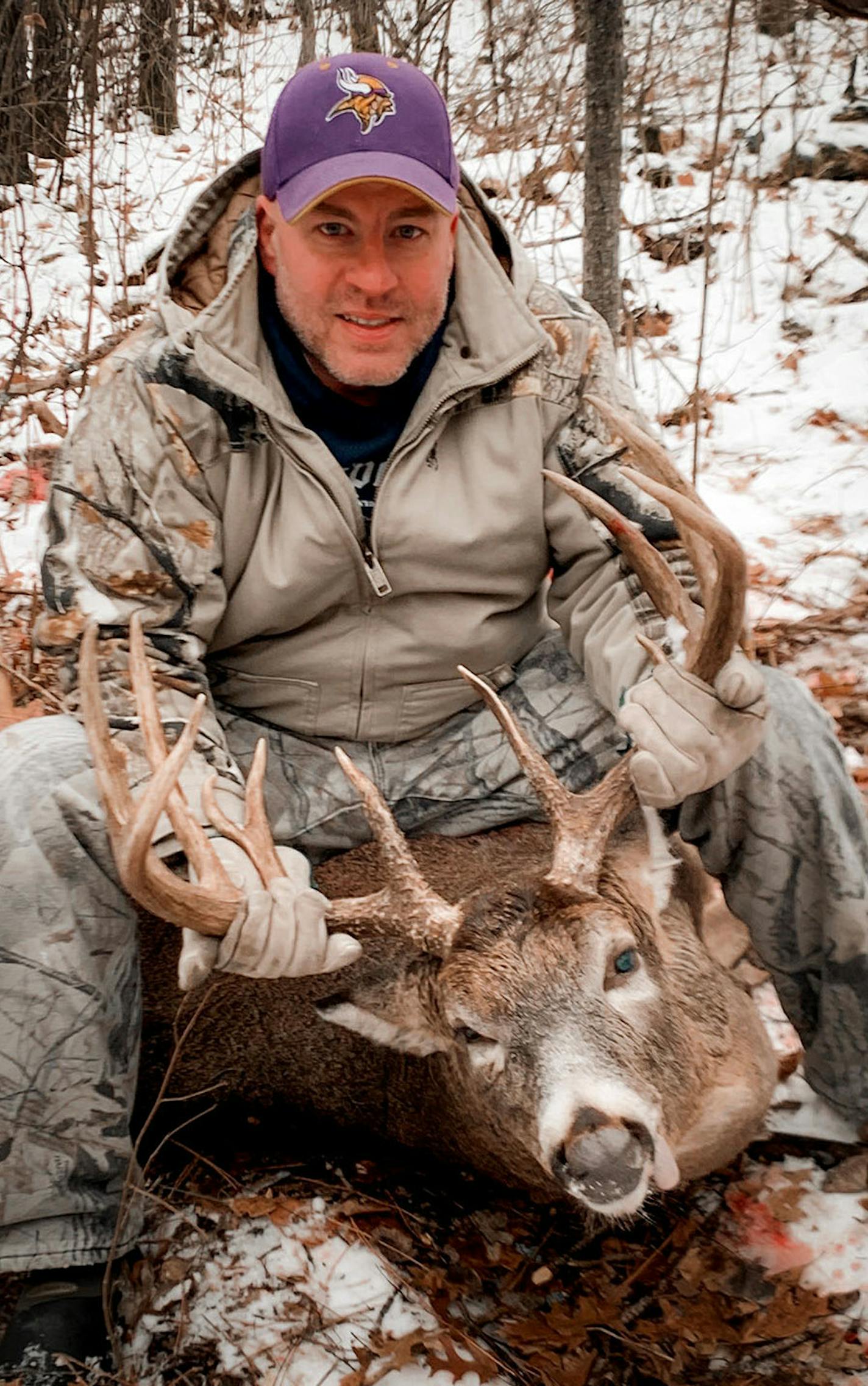 Tim Gulland, 39, of Mayer, Minn., with the 14-point buck he shot at 7:57 a.m. on opening day on state public land near White Earth. With a green score of 179, it broke the trophy buck record for his family-and-friends deer camp that had stood since 1986. The tent camp is a 70-year-old tradition.