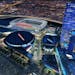 FILE - In a file image released by AEG, a proposed NFL football stadium, to be named Farmers Field, is depicted next to Staples Center in Los Angeles.