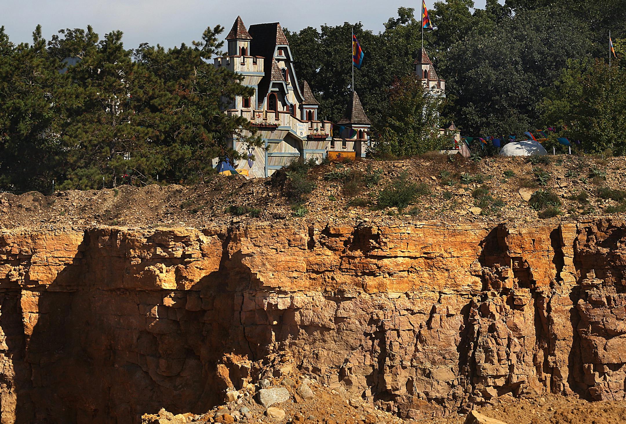 A canyon-esque swath of mining separates the parking areas from the Renaissance Festival grounds in the southwest metro.