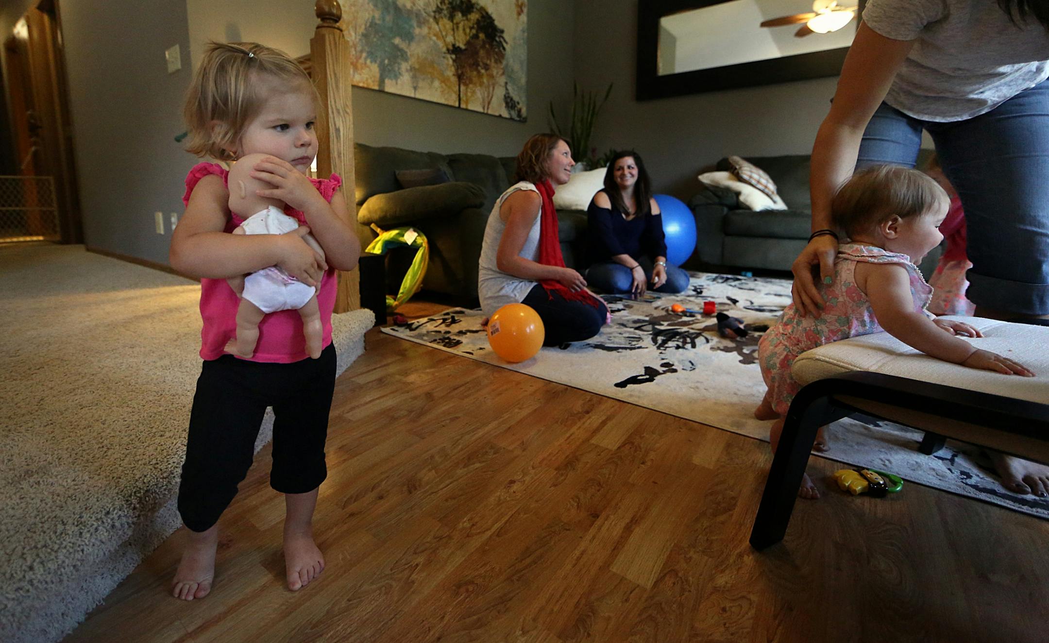 Amy Korkki�s daughter, Lydia, 20 months, held a doll tightly during the playdate.