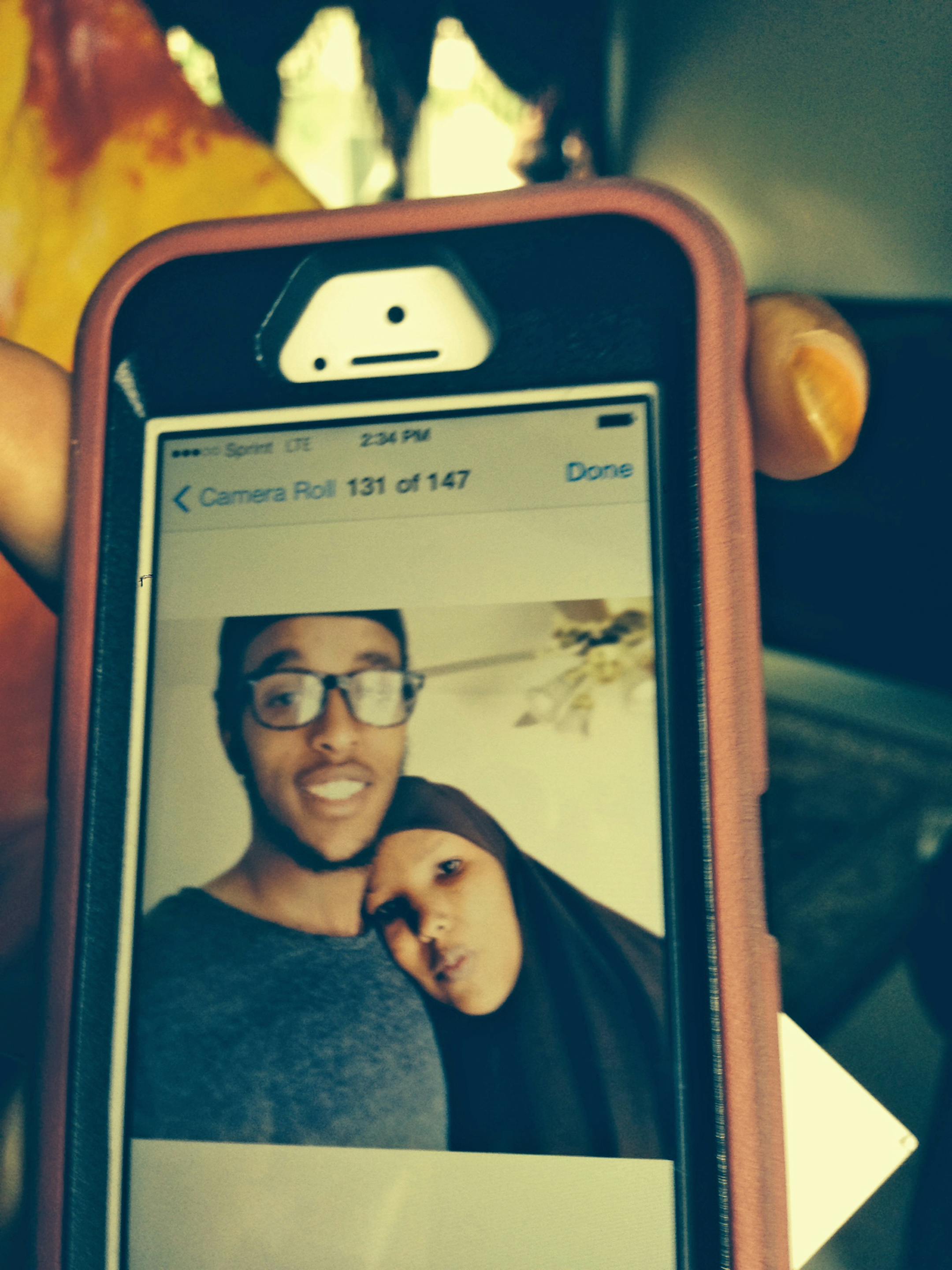 Photo of Abdi Mohamed Nur, 20, with his mother, Sadiyo Omar, both from Minneapolis. He was flew to Turkey last Saturday and believed to be traveling to Syria to join the civil war against the regime. Photo: Randy Furst - Star Tribune Minneapolis, MN 6/4/14 (Randy took photo of the mom's phone with the photo on it. ) ORG XMIT: MIN1406041641490954
