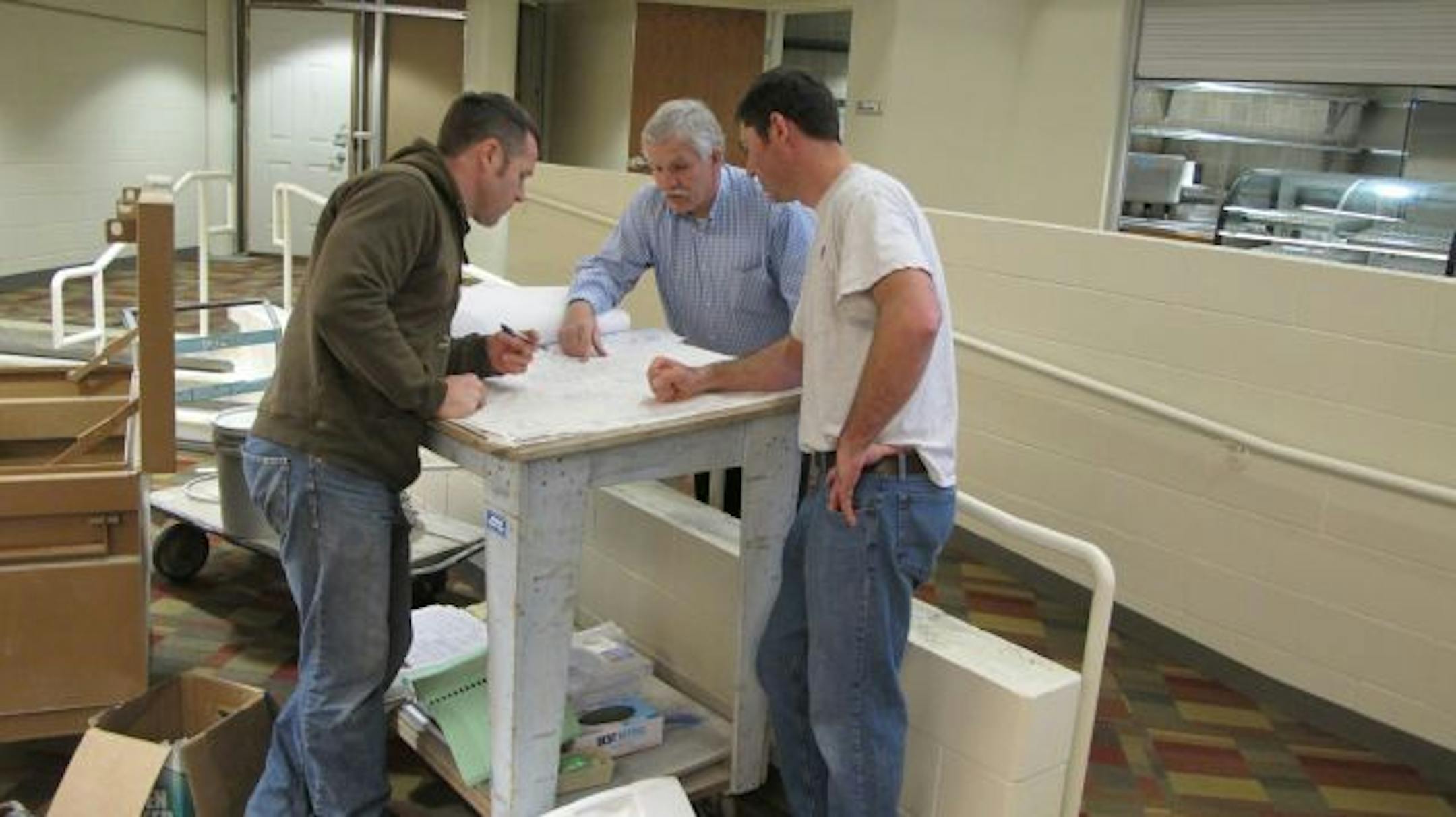 Photo by Tim HarlowWorkers put the final touches on a new multi-million dollar student center at Century College in White Bear Lake. The center will be in the space of the former library, which moved to a new space two years ago. The new center will have a coffee shop, stage, games and student government offices.