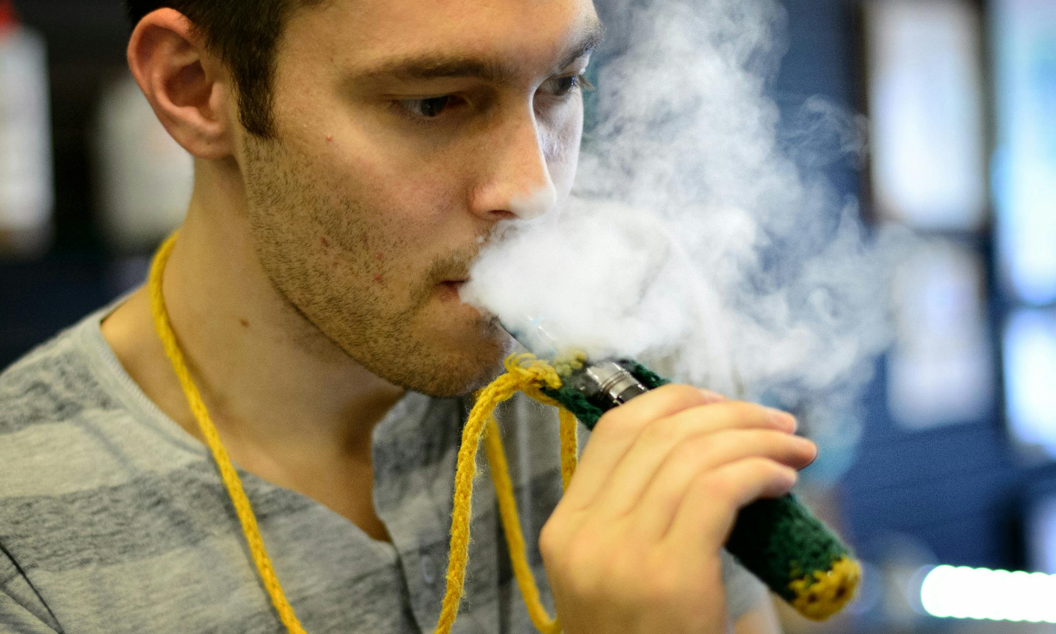 E-cigarettes emit a mild vapor that dissipates quickly. Uptown Vapor Shoppe employee Ryan Comings puffed as he helped a customer. Star Tribune