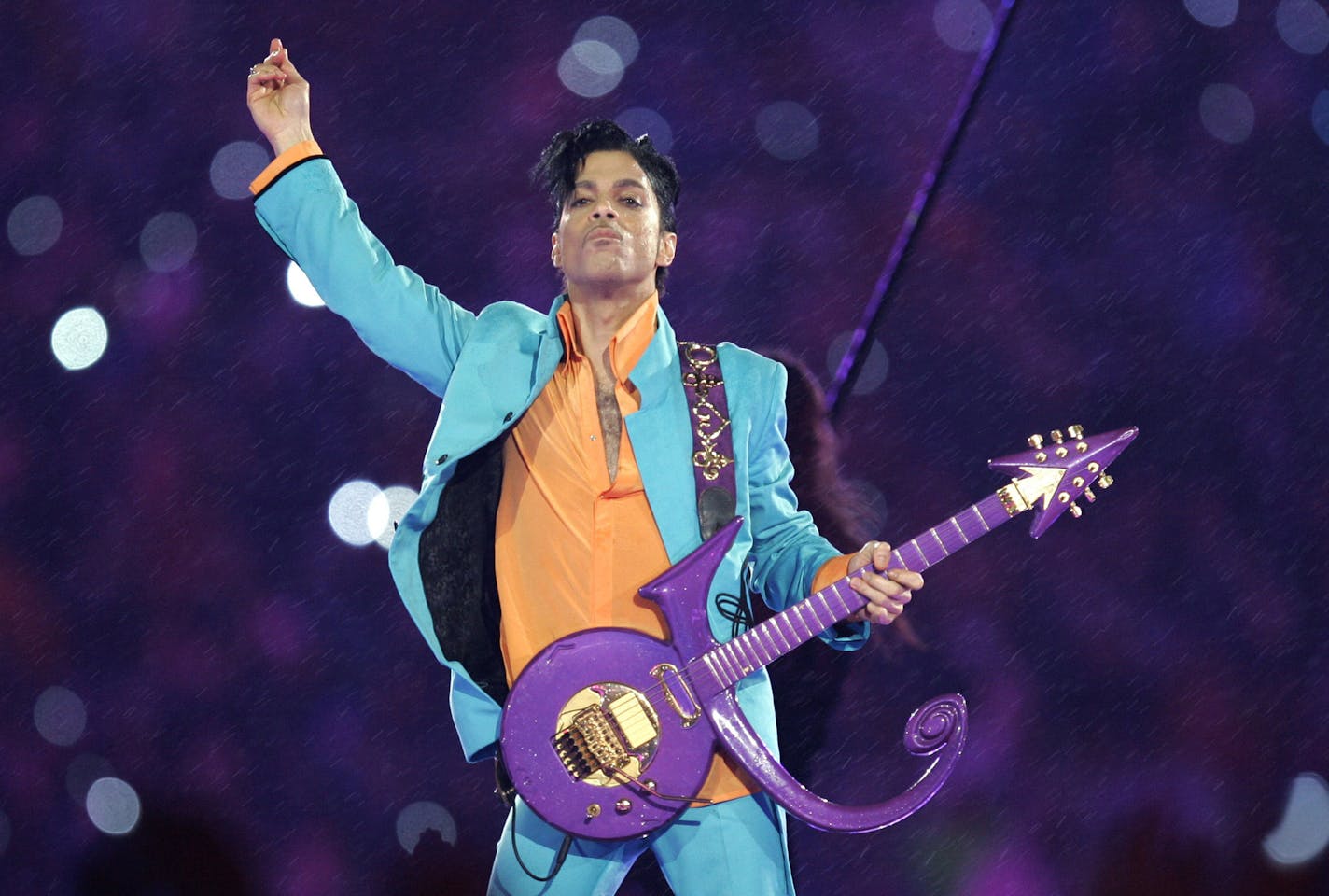 FILE - In this Feb. 4, 2007, file photo, Prince performs during the halftime show at the Super Bowl XLI football game in Miami. A new song from Prince&#xed;s late father, produced at Paisley Park, is being released Thursday, June 29, 2017, to celebrate what would have been his 101th birthday. (AP Photo/Chris O'Meara, File)