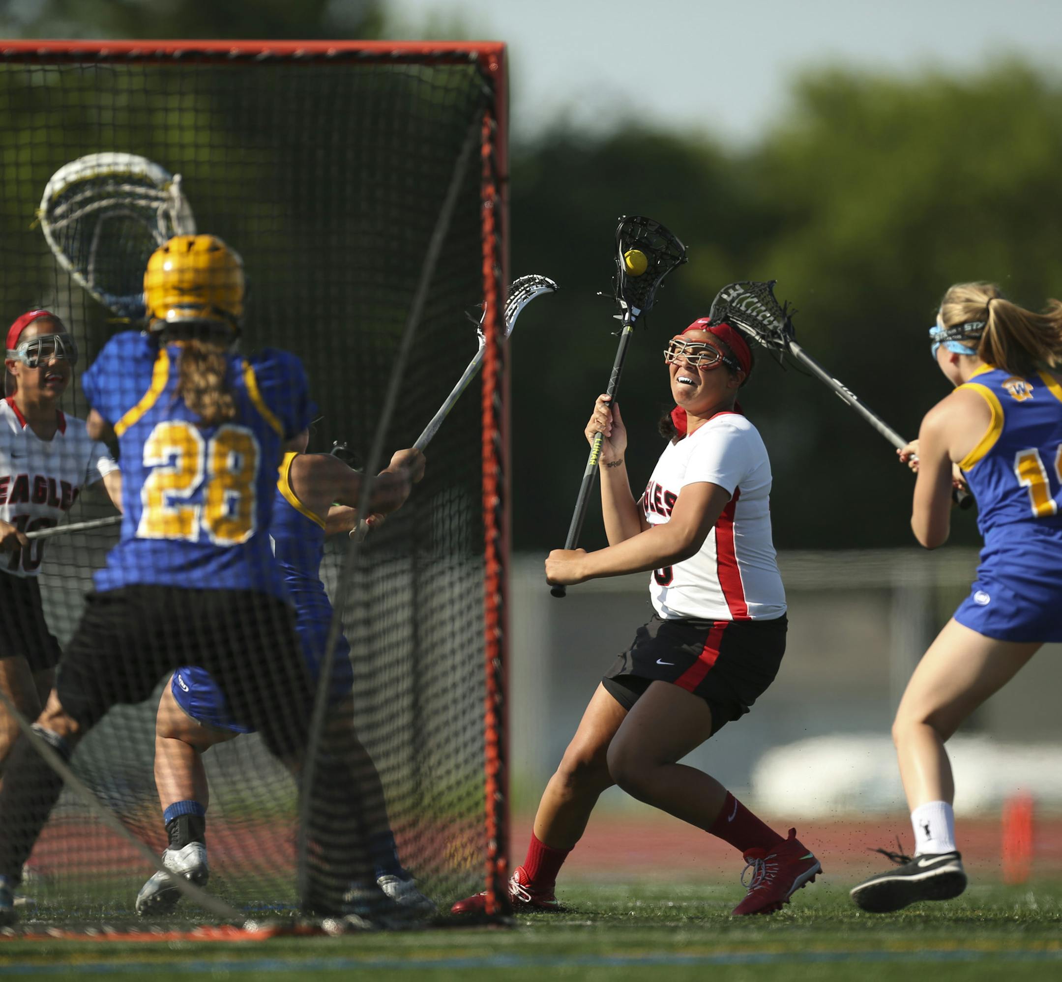 Eden Prairie's Payton Borg lined up a shot in the first half against Wayzata goaltender Paige Sorensen (28) Tuesday evening in Minnetonka. ] JEFF WHEELER ï jeff.wheeler@startribune.com Eden Prairie dominated Wayzata in their girls state lacrosse tournament quarterfinal game at Hopkins High School in Minnetonka Tuesday evening, June 9, 2015.