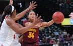 Gophers guard Gadiva Hubbard passed to a teammate under pressure in the first half during the 2018 Big Ten women's basketball tournament.