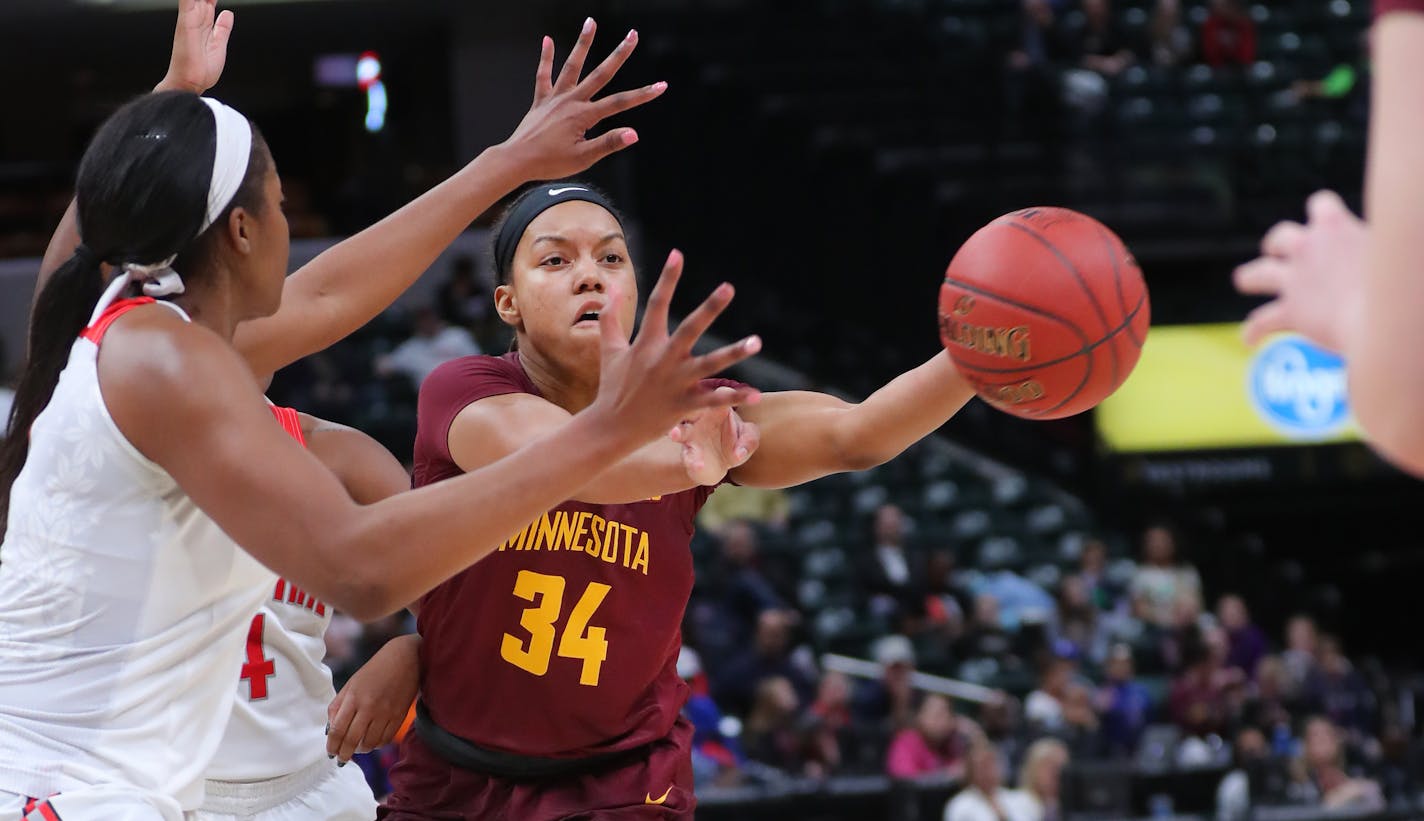 Gophers guard Gadiva Hubbard passed to a teammate under pressure in the first half during the 2018 Big Ten women's basketball tournament.