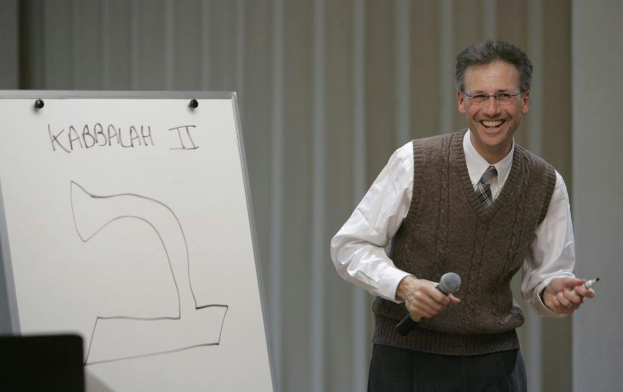Rabbi Sim Glaser lectures during his class on mystical Jewish texts Monday night at Temple Israel. GENERAL INFORMATION: Staff photo by Jeff Wheeler MINNEAPOLIS - 11/29/04 - As part of Temple Israel's Jewish Learning Institute, Rabbi Sim Glaser is teaching a class on Kabbalah called Introduction to Jewish Mysticism. The class met for the first time Monday night at the temple, with nearly fifty people in attendance.