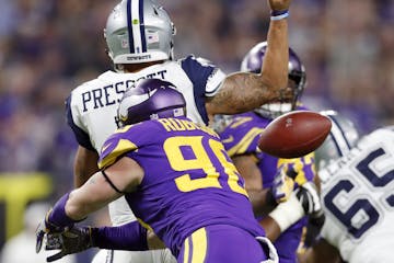 Minnesota Vikings defensive end Brian Robison (96) forced a fumble on Dallas Cowboys quarterback Dak Prescott (4) in the third quarter , the ball was 