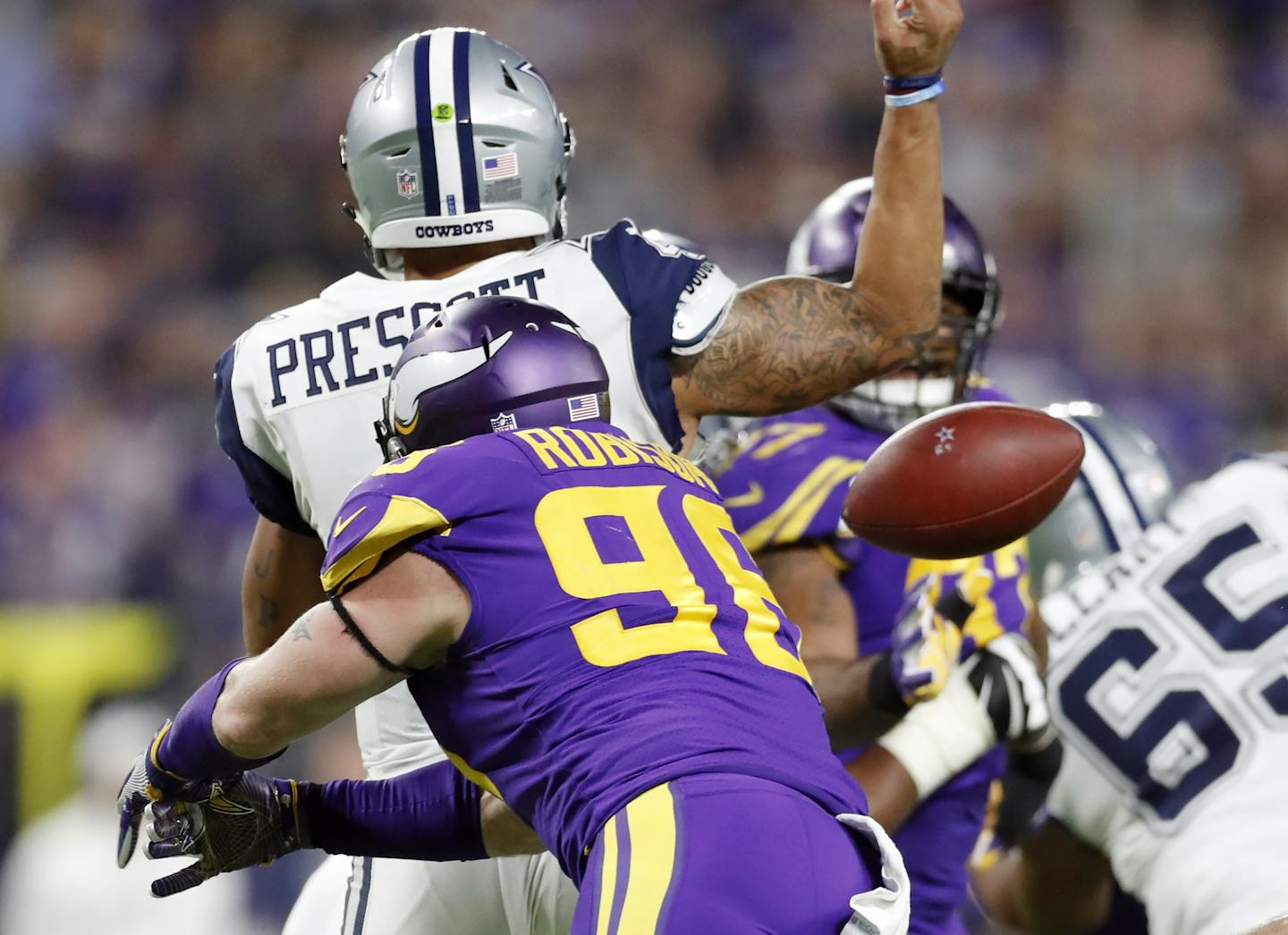 Minnesota Vikings defensive end Brian Robison (96) forced a fumble on Dallas Cowboys quarterback Dak Prescott (4) in the third quarter , the ball was recovered \by Minnesota Vikings defensive end Everson Griffen (97) at U.S. Bank Stadium Thursday December 01,2016 in Minneapolis MN. The Minnesota Vikings hosted the Dallas Cowboys ] Jerry Holt / jerry. Holt@Startribune.com