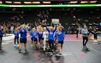 St. Michael-Albertville's captains led their team off after the Knights received their championship trophy Thursday.