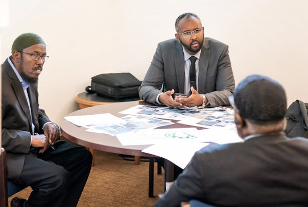 Abdulaziz Sugule, head of Somali American Money Services Association, Jaylani Hussein, executive director of CAIR-Minnesota, and Imam Hassan Mohamud, 