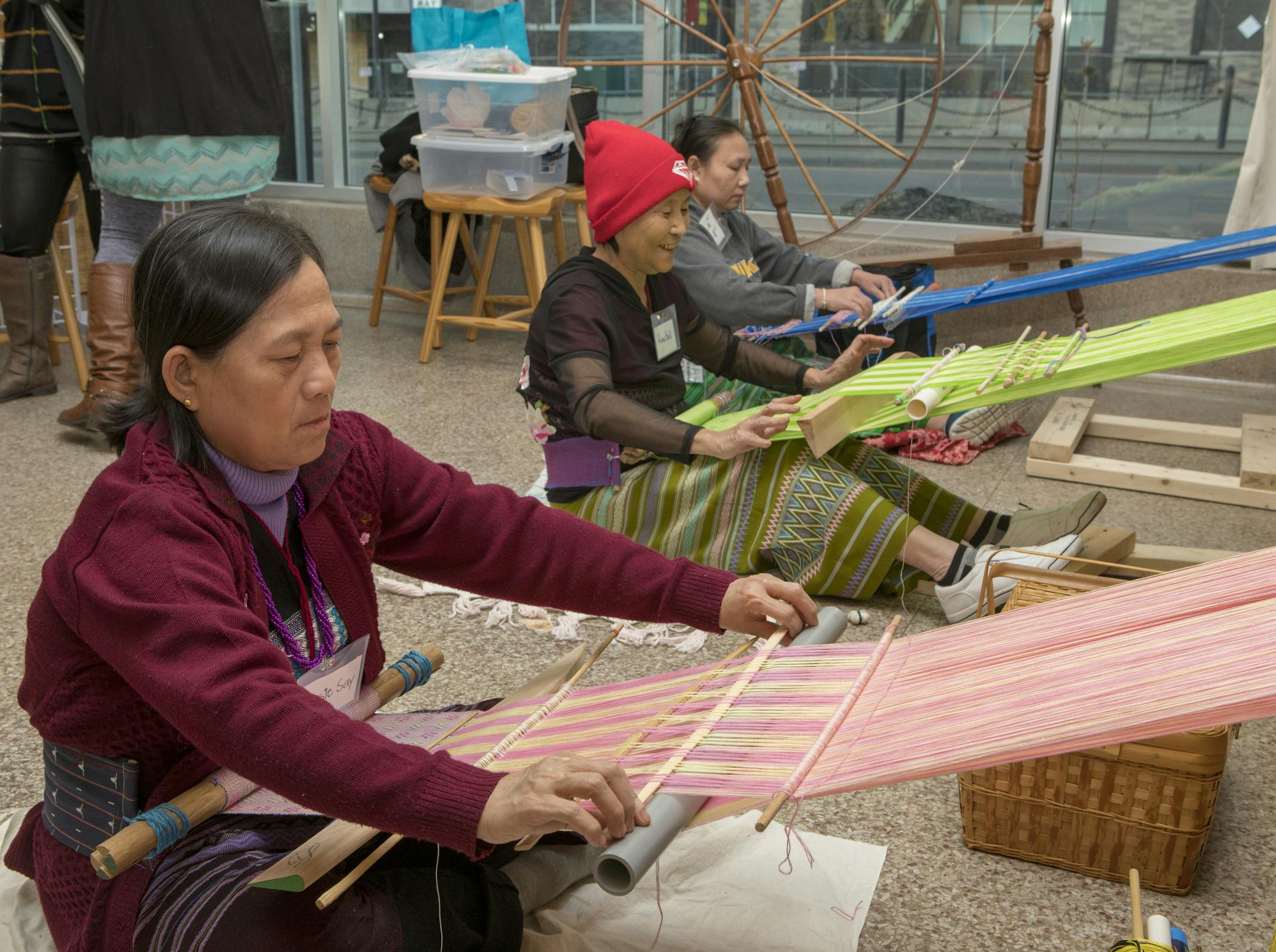 Weavers Rosie Say, Rose Bell and Kay Paw demonstrate their art at Cocktails by Design. [ Special to Star Tribune, photo by Matt Blewett, Matte B Photography, matt@mattebphoto.com, Goldstein Museum of Design, Cocktails by Design, March 22, 2018, , Minnesota, SAXO 1005784328 FACE040118 Rosie Say (pink)
Rose Bell (green)
Kay Paw (blue)