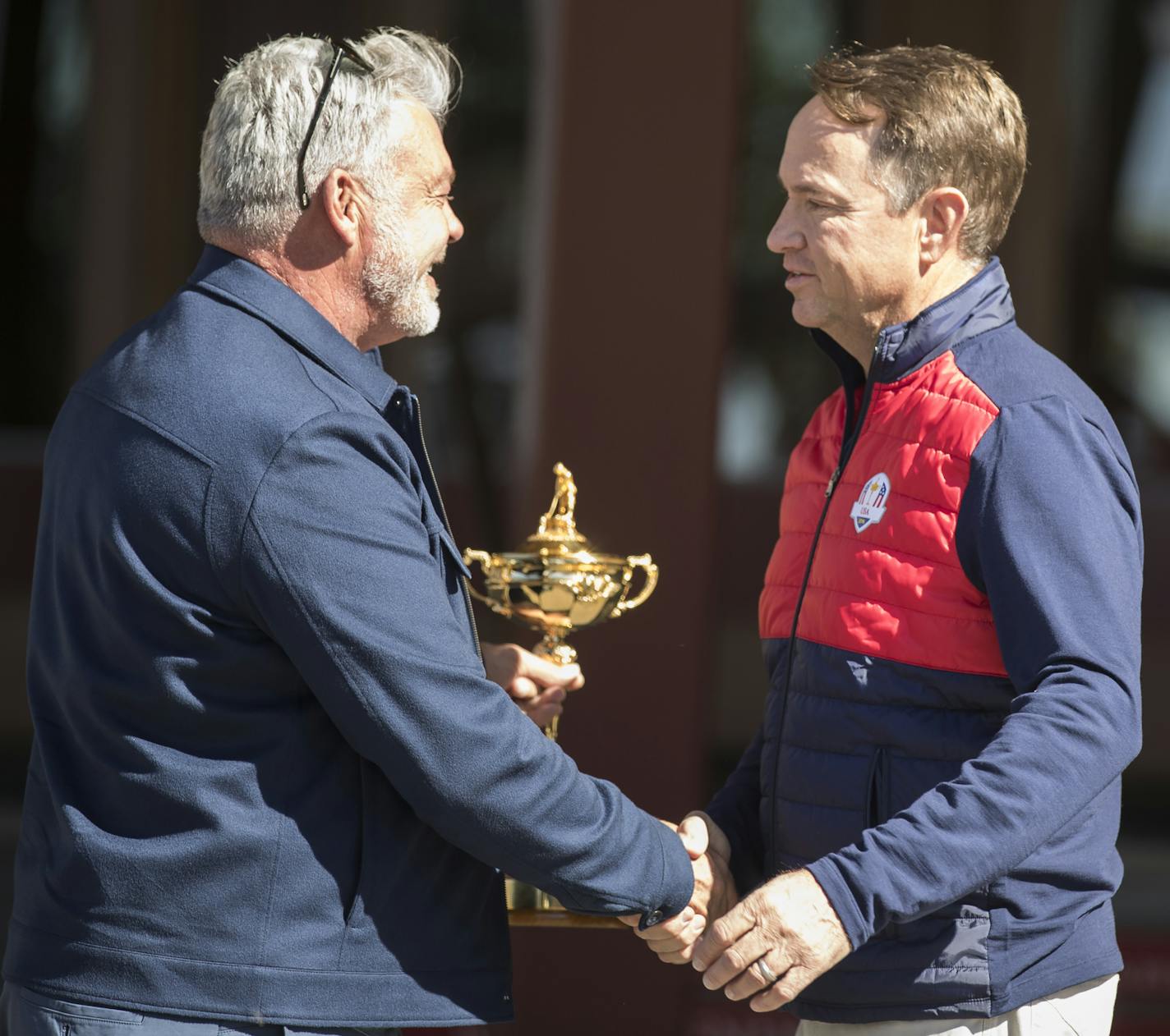 United States Ryder Cup Captain Davis Love III, right, greets European Captain Darren Clarke at Hazeltine National Golf Club. ] (Leila Navidi/Star Tribune) leila.navidi@startribune.com BACKGROUND INFORMATION: United States Ryder Cup Captain Davis Love III and official party greets and welcomes European Captain Darren Clarke and their official party to Hazeltine National Golf Club in Chaska for the 2016 Ryder Cup on Monday, September 26, 2106.