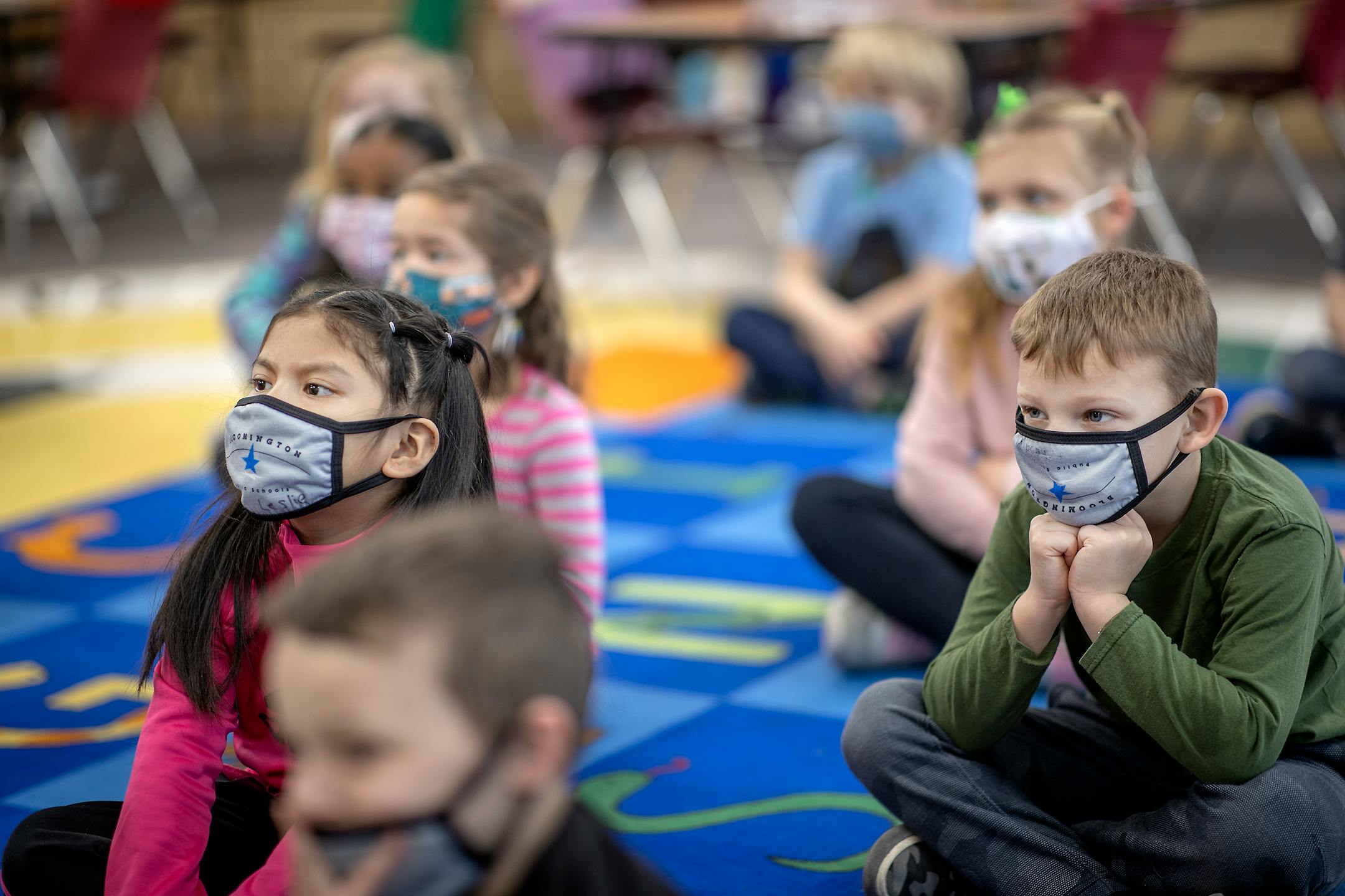 Poplar Elementary School kindergarteners listened to their teacher Ruth Haugstad from their designated seating areas during the first day of full in person instruction, Tuesday, January 19, 2021 in Bloomington, MN.